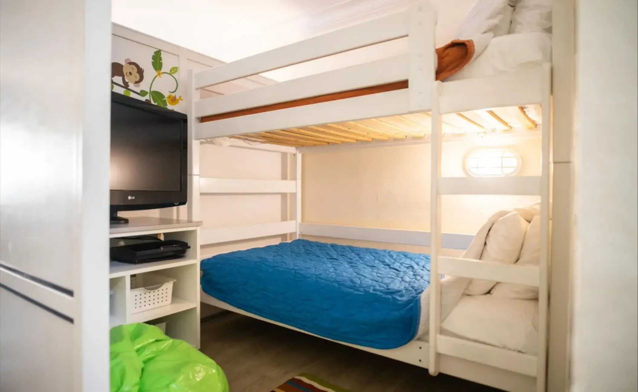 Family room with white bunk beds and a blue comforter at Catalonia Montego Bay, Montego Bay
