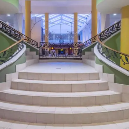 Grand lobby staircase with decorative iron railings at Catalonia Montego Bay, Montego Bay