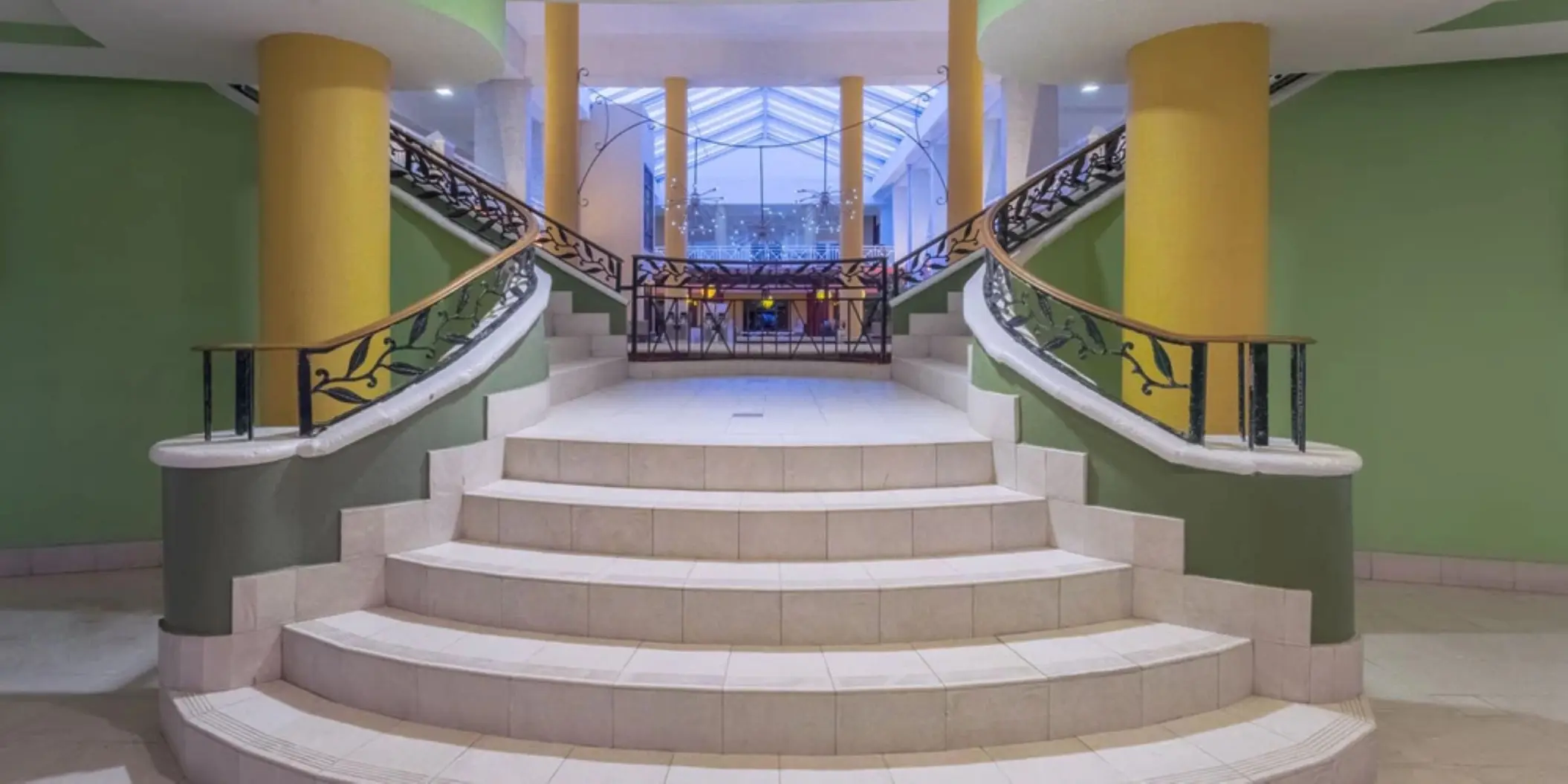 Grand lobby staircase with decorative iron railings at Catalonia Montego Bay, Montego Bay