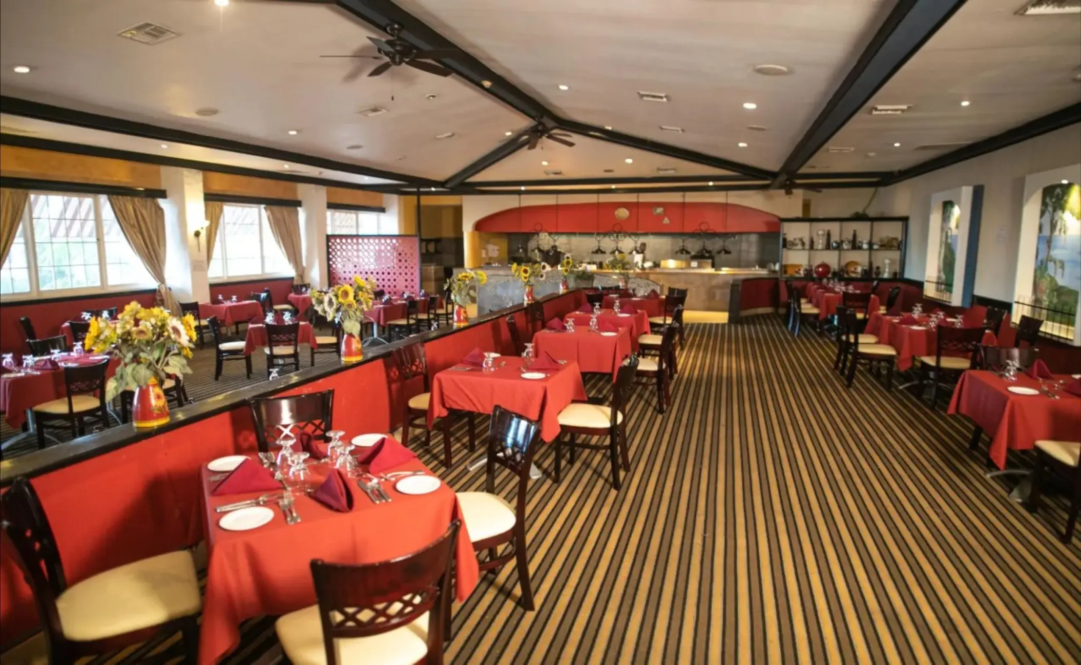 Mamma Mia restaurant dining room with red tablecloths at Catalonia Montego Bay, Jamaica