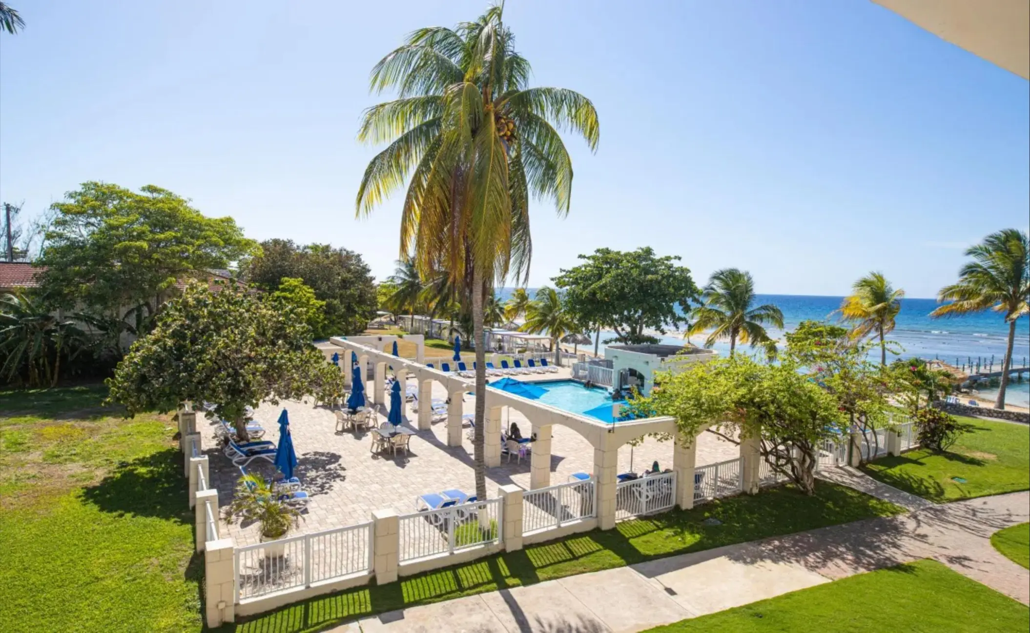 Catalonia Montego Bay pool area and terrace with palm trees, Montego Bay