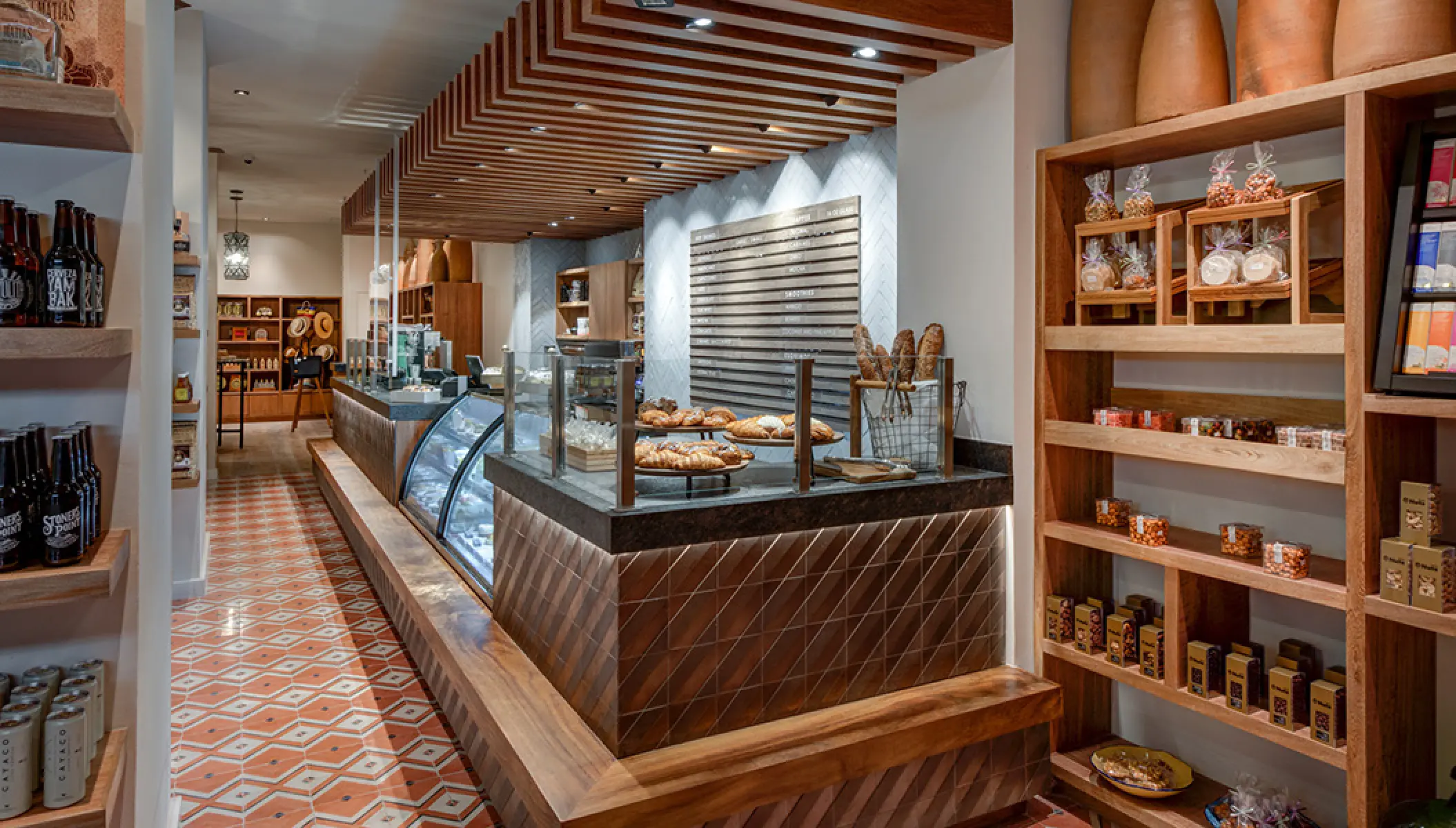 Colibri cafe and deli featuring wooden shelving and pastry displays at Conrad Punta de Mita, Puerto Vallarta