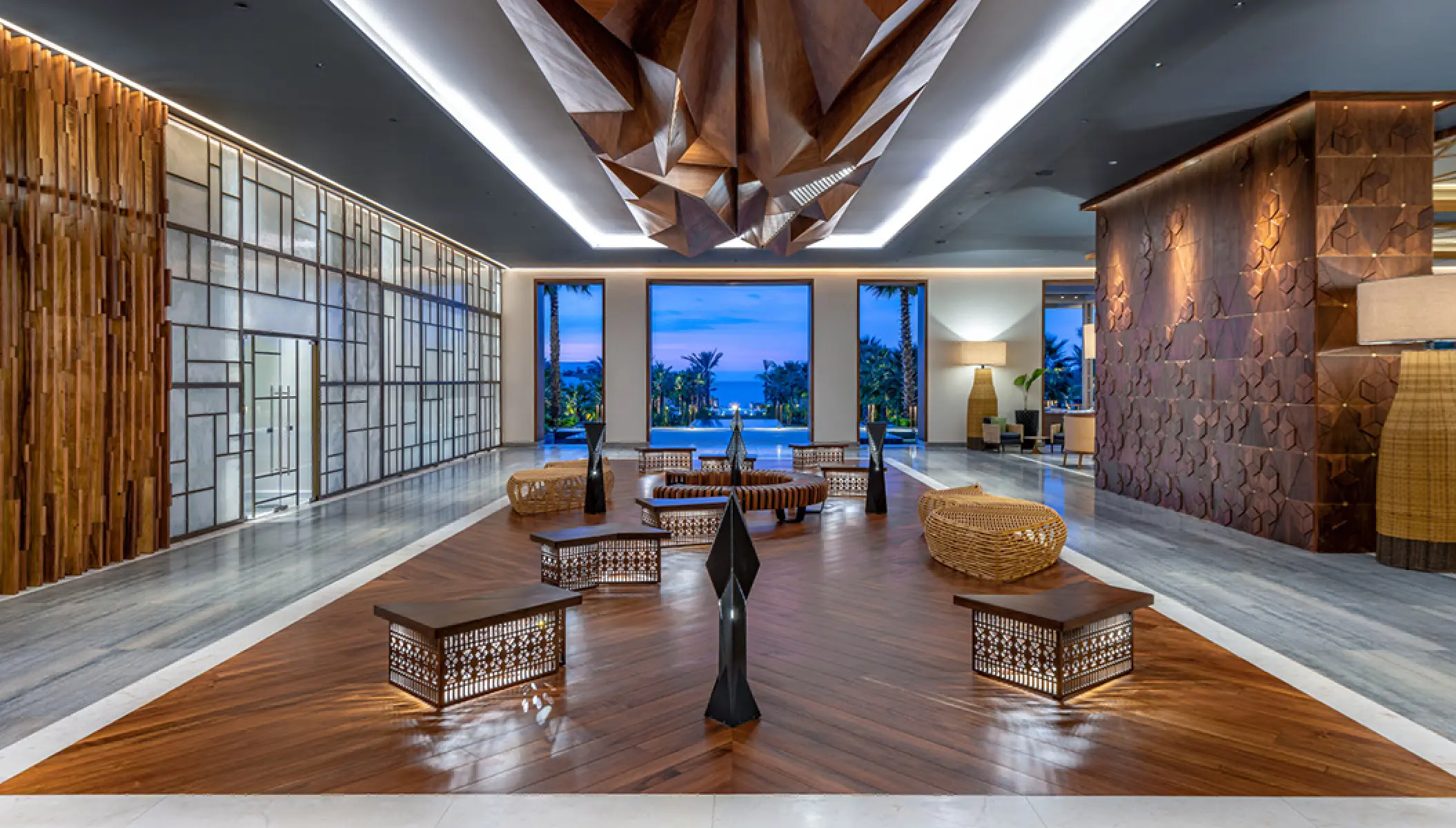 Modern open-air lobby with geometric wooden features at Conrad Punta de Mita, Puerto Vallarta