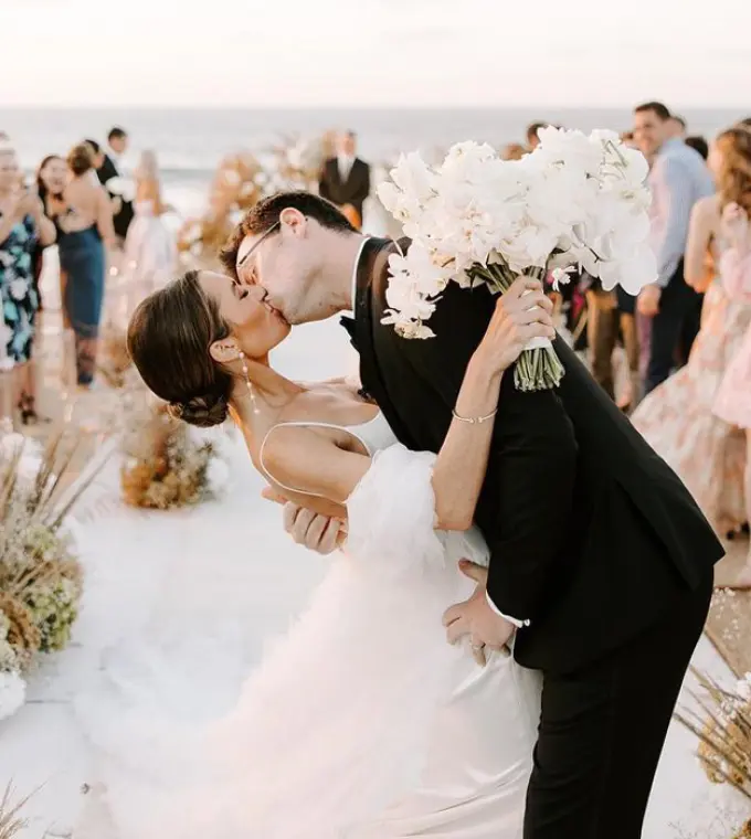 Bride and groom kissing at their beach ceremony at Conrad Punta de Mita, Puerto Vallarta