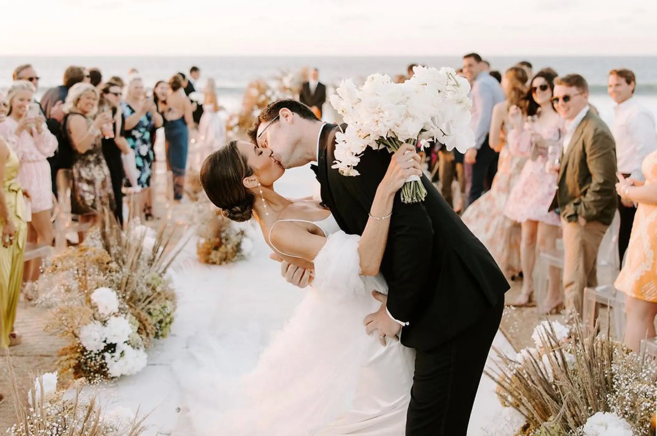 Bride and groom kissing at their beach ceremony at Conrad Punta de Mita, Puerto Vallarta