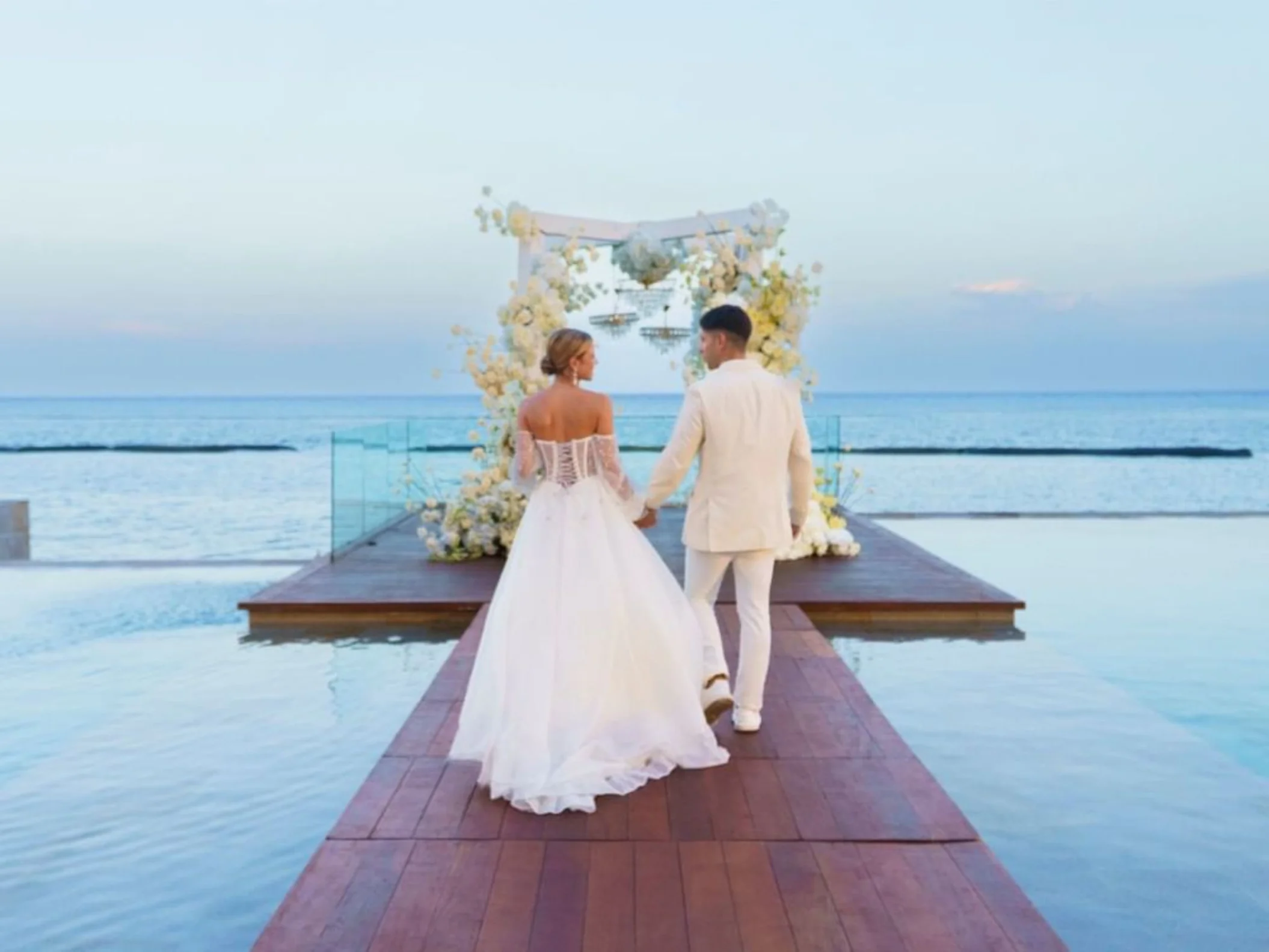 bride and groom at the infinity venue at Devossion by Live Aqua Playa del Carmen