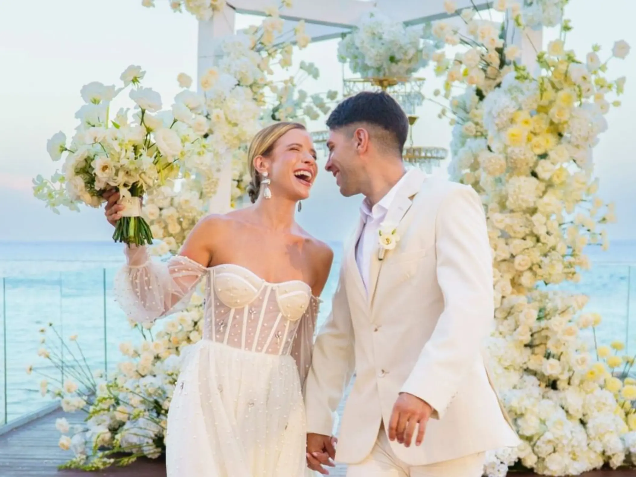 The bride and groom laughing at an infinity deck wedding ceremony, Devossion by Live Aqua Playa del Carmen
