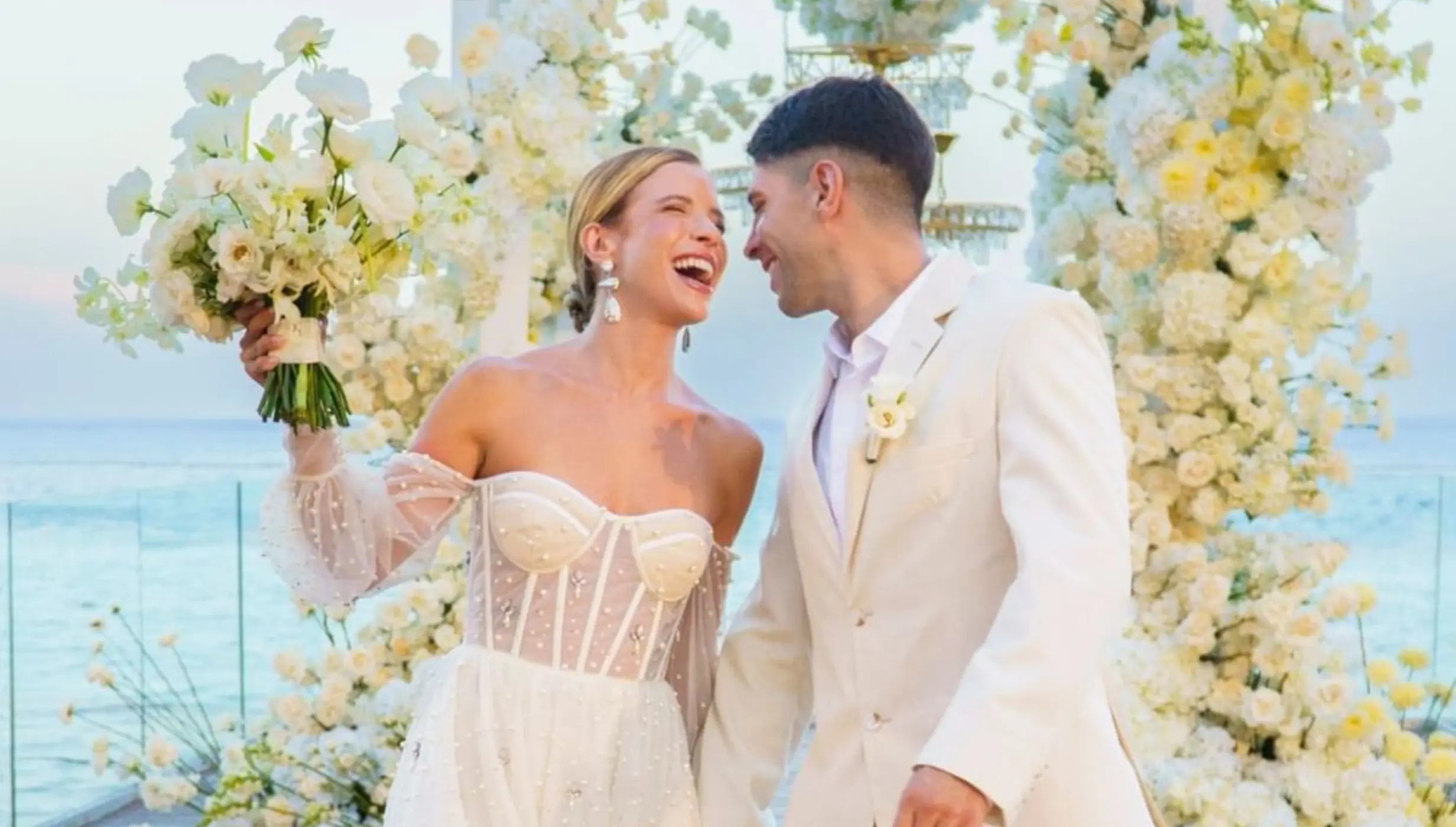 The bride and groom laughing at an infinity deck wedding ceremony, Devossion by Live Aqua Playa del Carmen