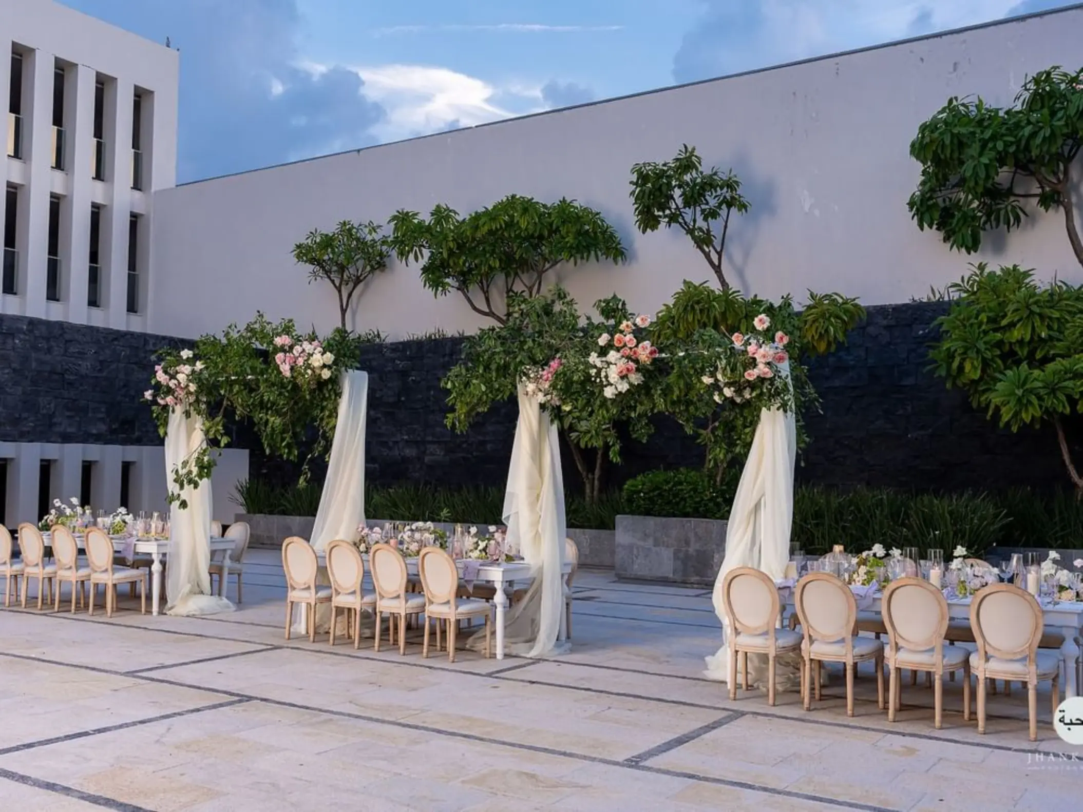Outdoor wedding reception setup at Citrus Patio, Live Aqua Playa del Carmen