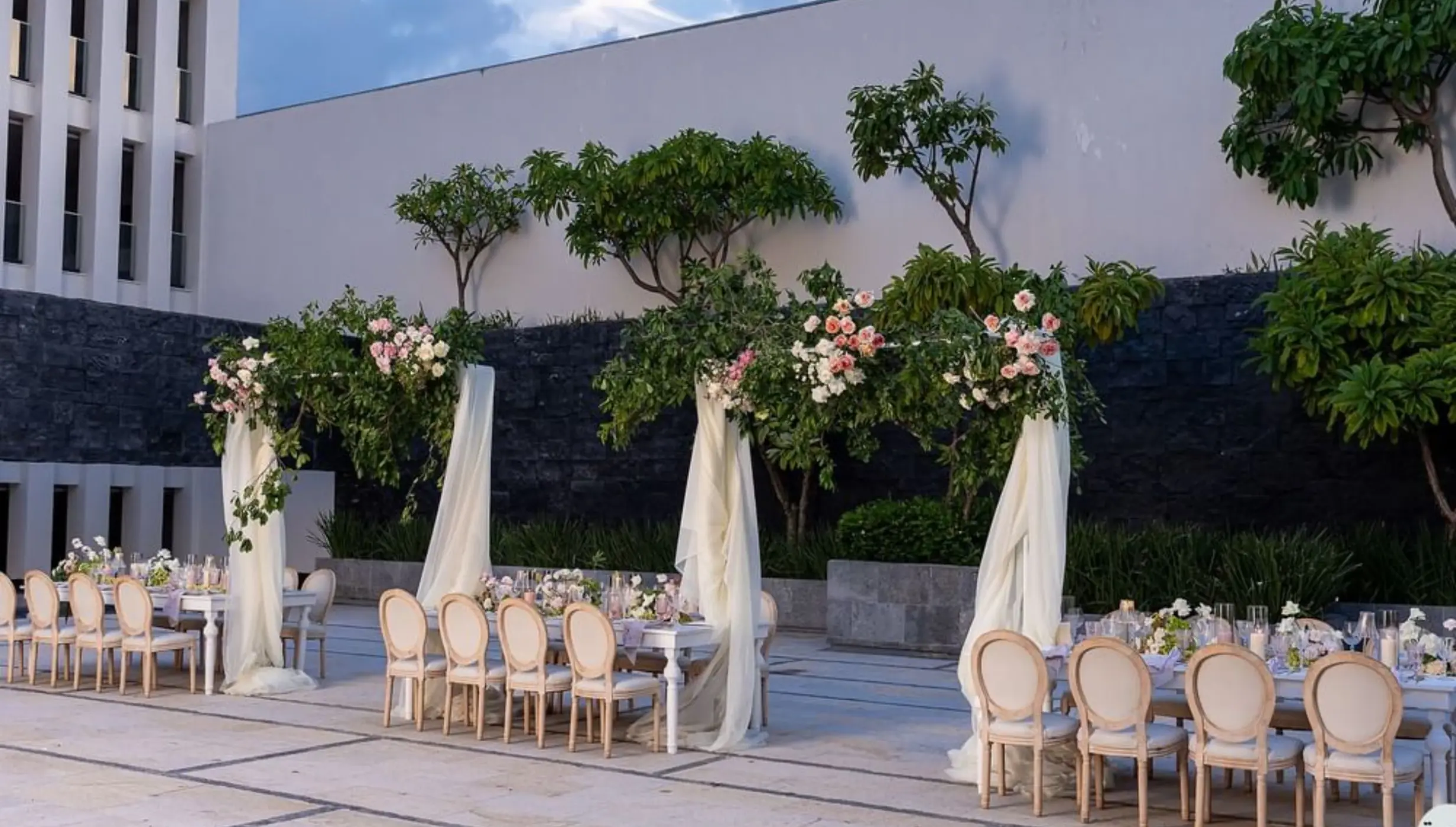 Outdoor wedding reception setup at Citrus Patio, Live Aqua Playa del Carmen