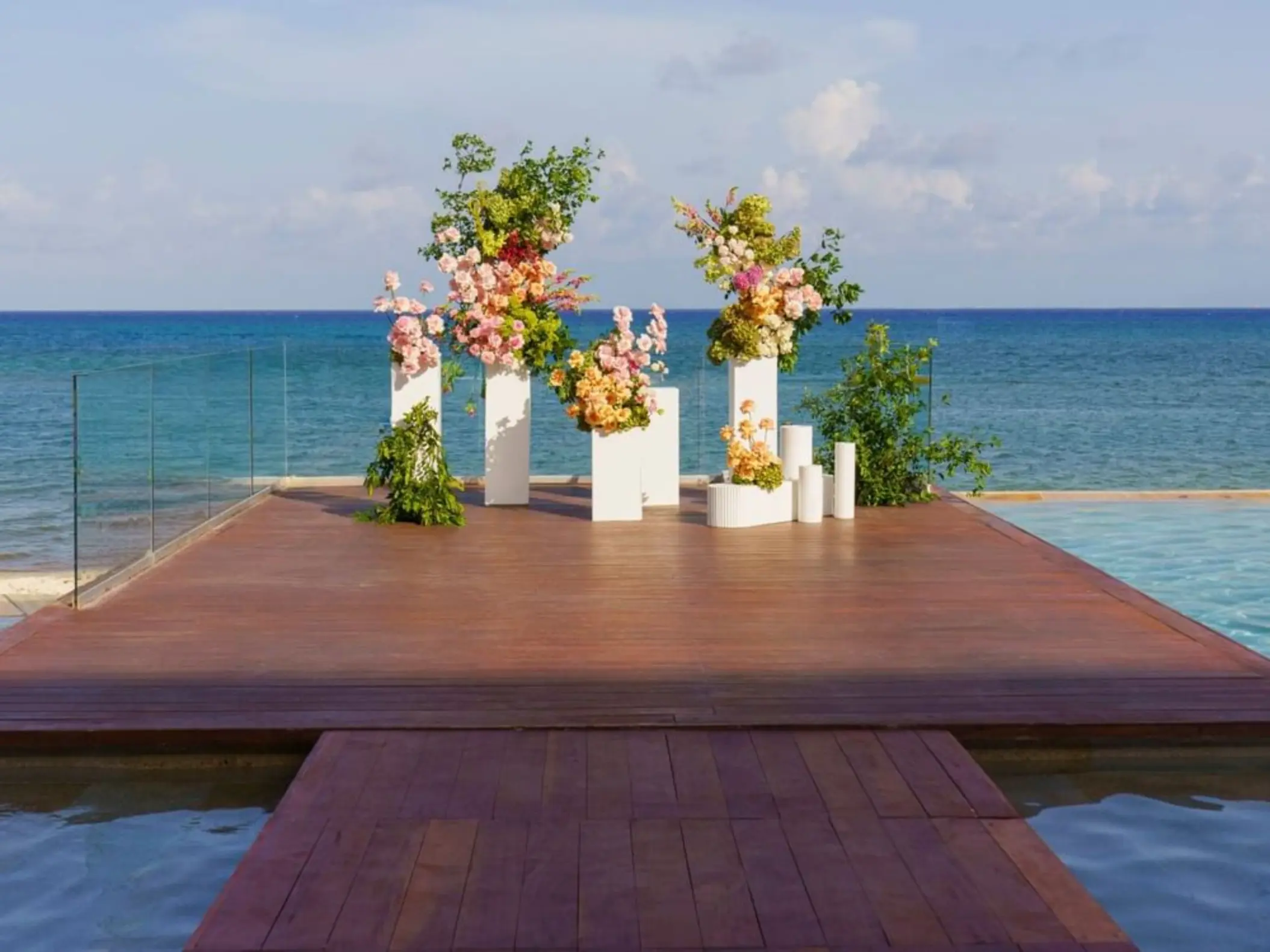 Floral ceremony setup on the infinity deck at Live Aqua Playa del Carmen