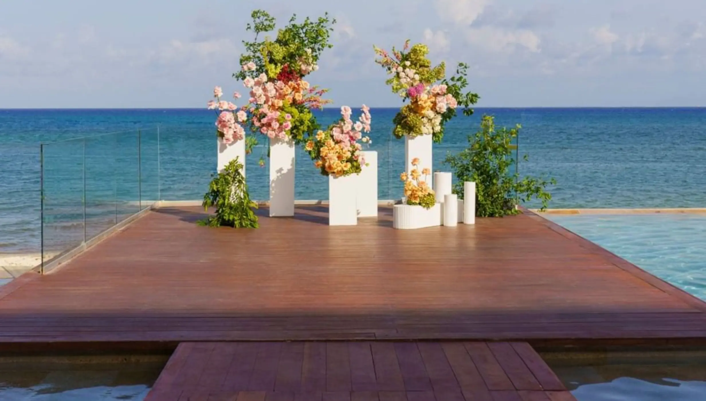 Floral ceremony setup on the infinity deck at Live Aqua Playa del Carmen