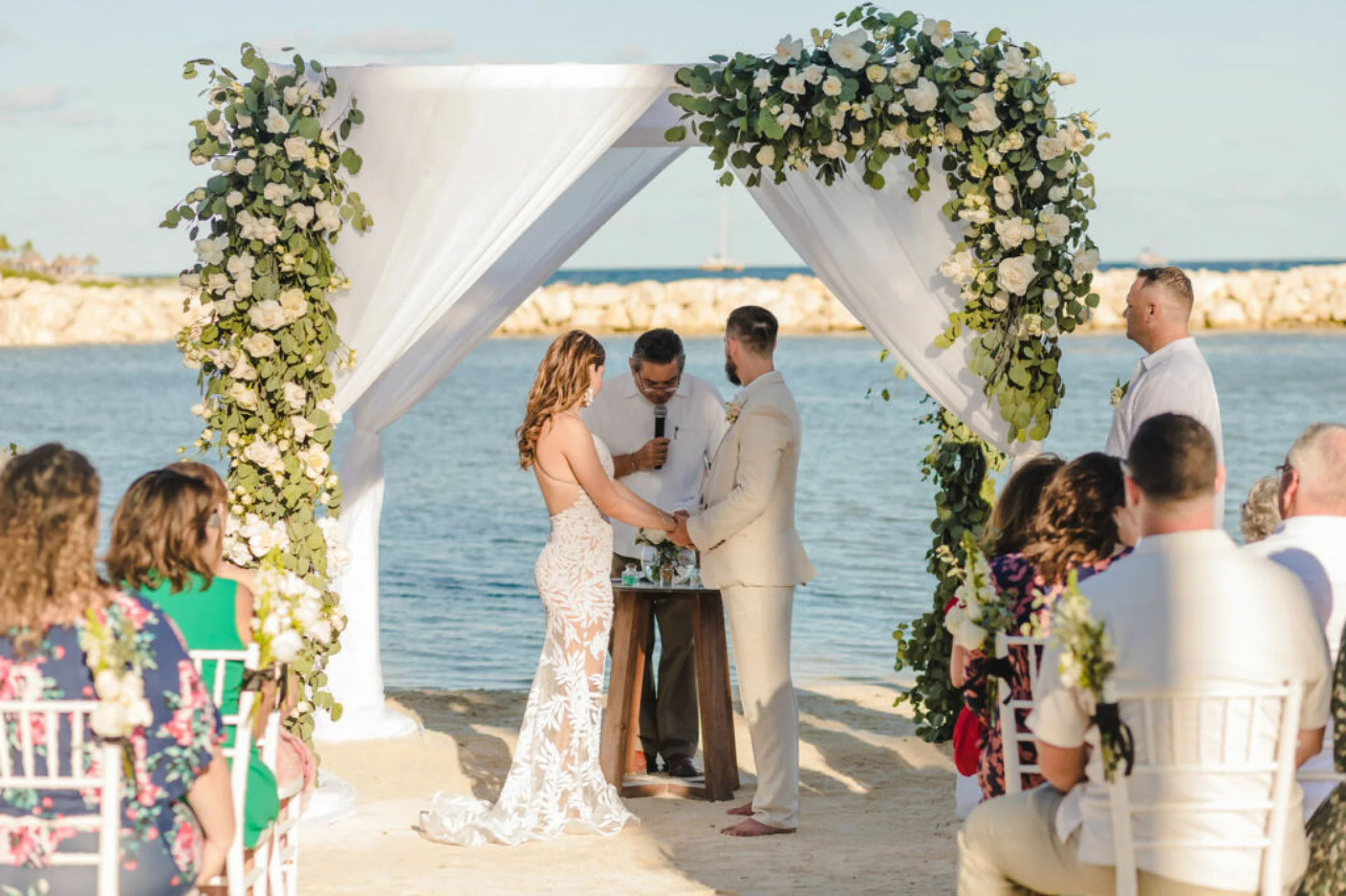 bride goom and guests at Dreams Aventuras Riviera Maya central beach venue