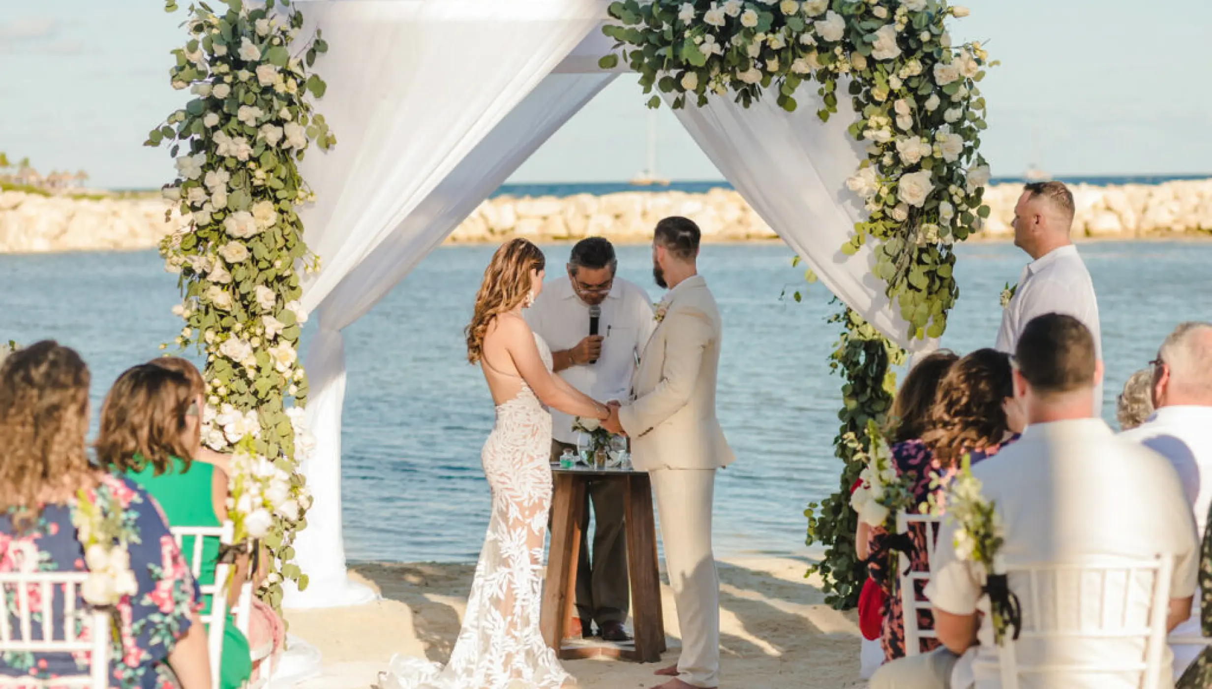 bride goom and guests at Dreams Aventuras Riviera Maya central beach venue
