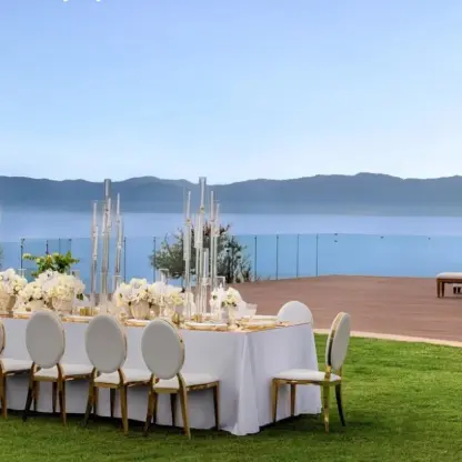 Wedding reception table and ceremony setup on the beach garden deck at Dreams Bahia Mita, Puerto Vallarta