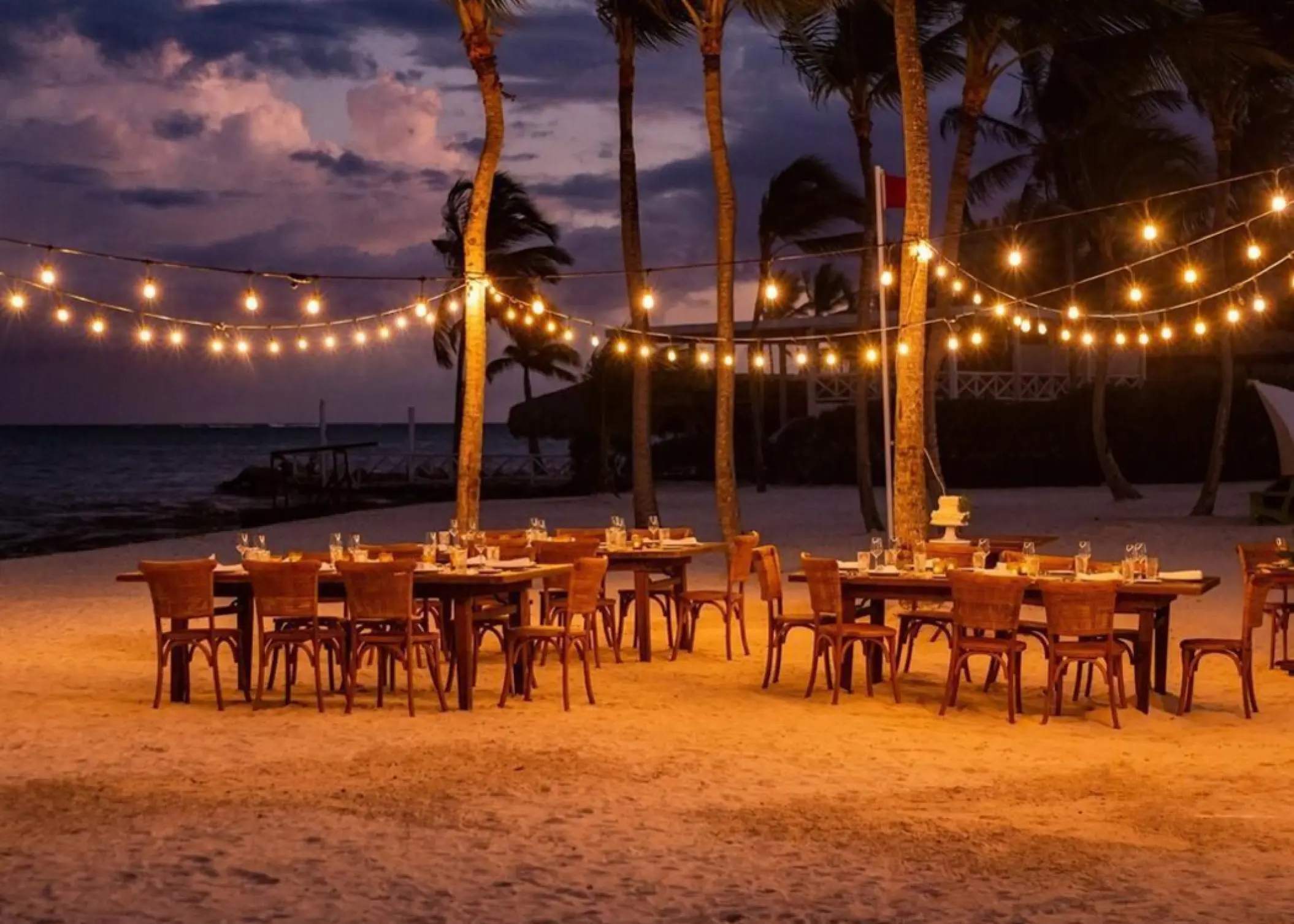 Beach wedding reception with string lights at Dreams Cap Cana, Punta Cana