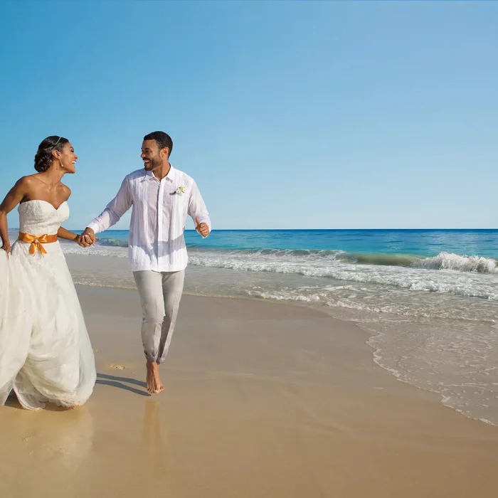 couple on the beach at dreams resort