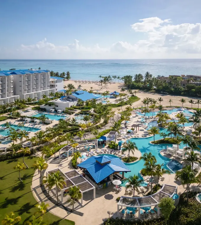 Aerial view of Dreams Cap Cana resort pools and white-sand beach, Punta Cana