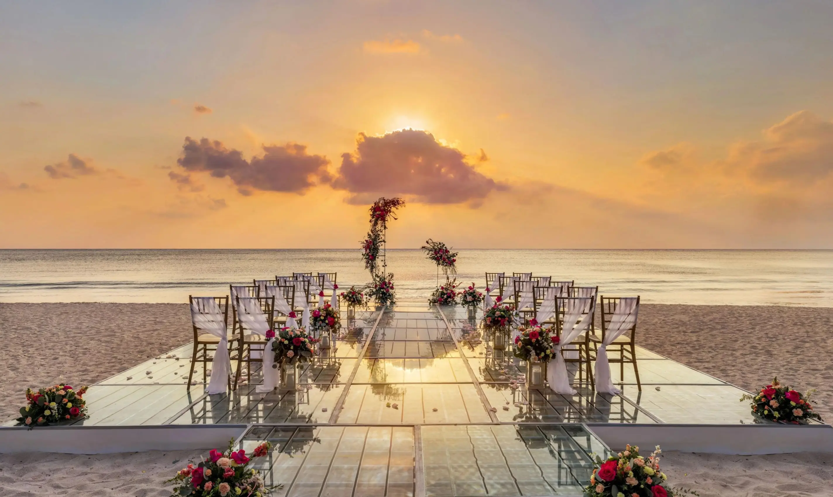 Beachfront wedding ceremony on a glass platform at Dreams Cozumel Cape, Cozumel