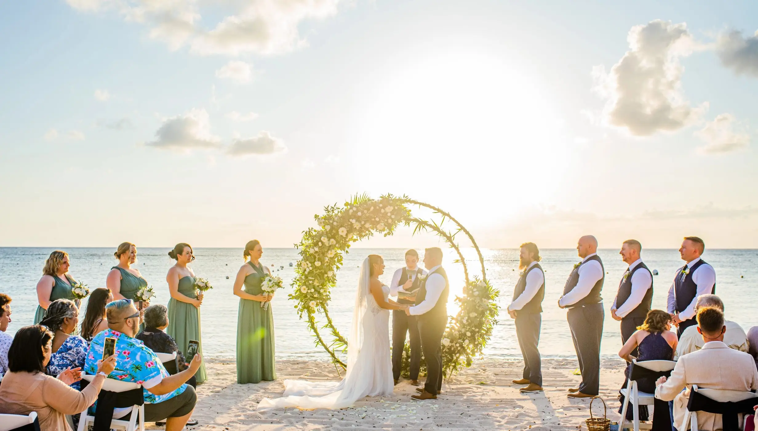 bride and groom and guests at the beach venue at Dreams Cozumel Cape Resort & Spa