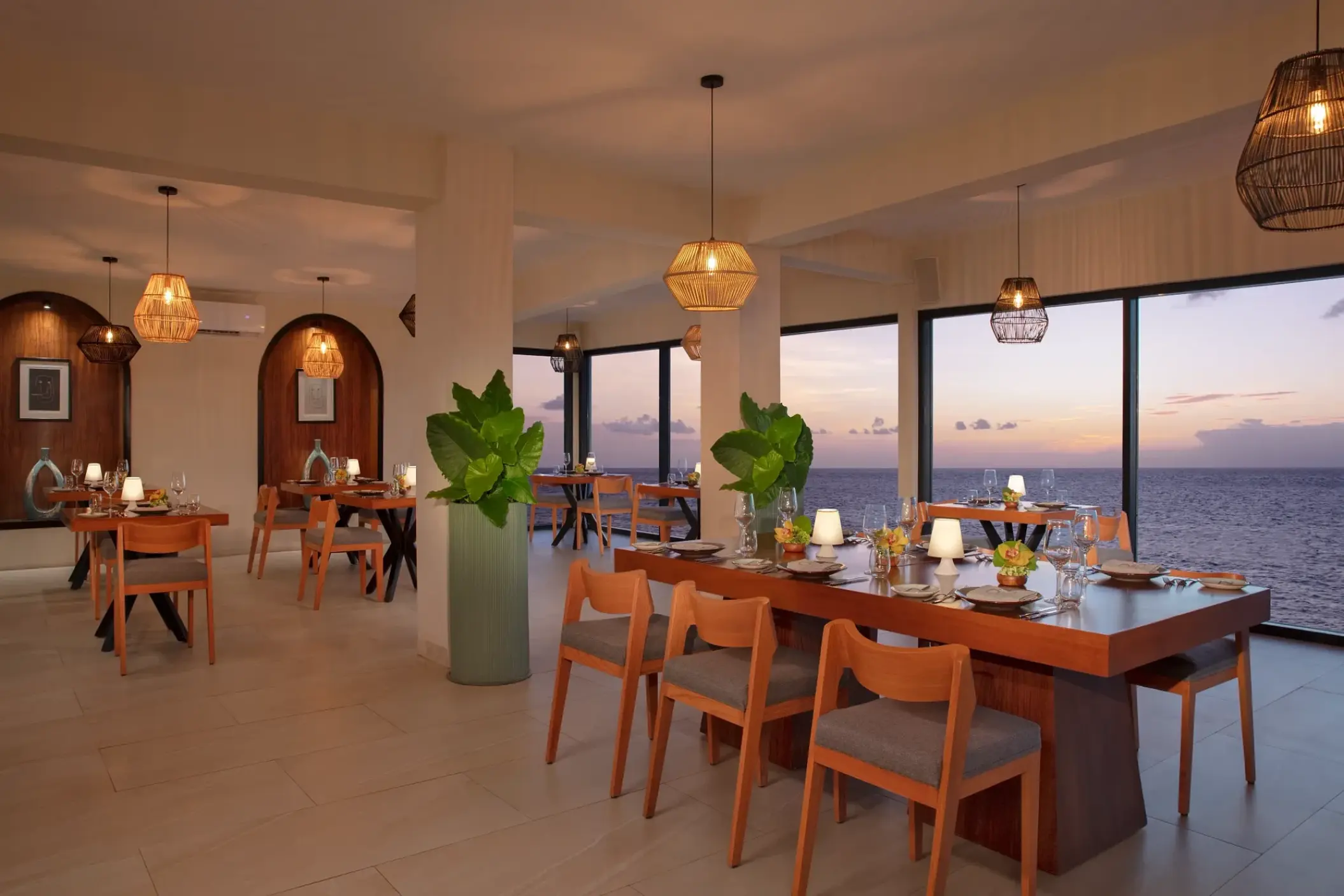 Olio restaurant interior with ocean views at Dreams Cozumel Cape, Cozumel