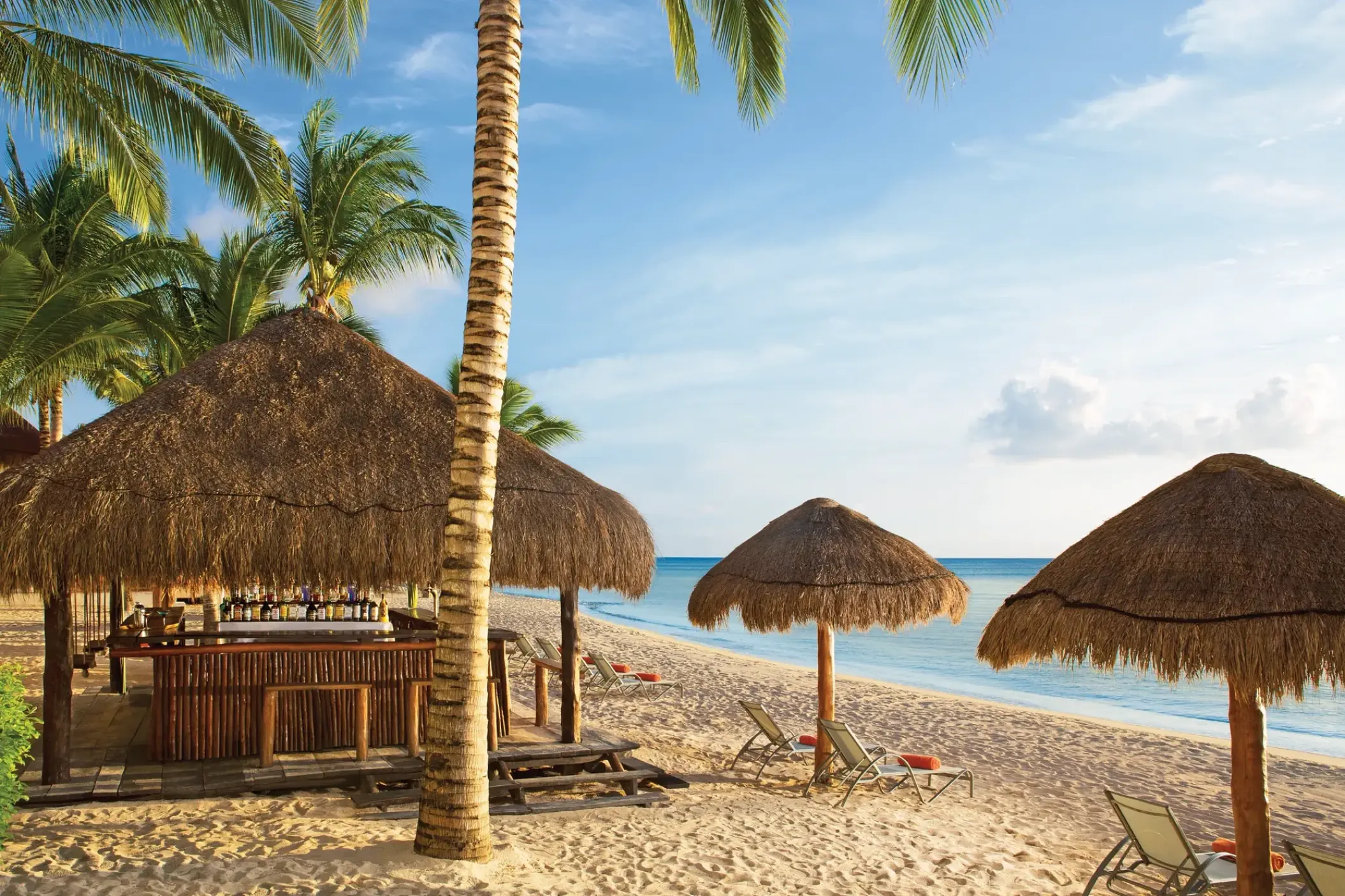 Sugar Reef beach bar under a thatched palapa at Dreams Cozumel, Cozumel