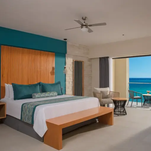 Master suite ocean view bedroom with a private balcony at Dreams Cozumel, Cozumel