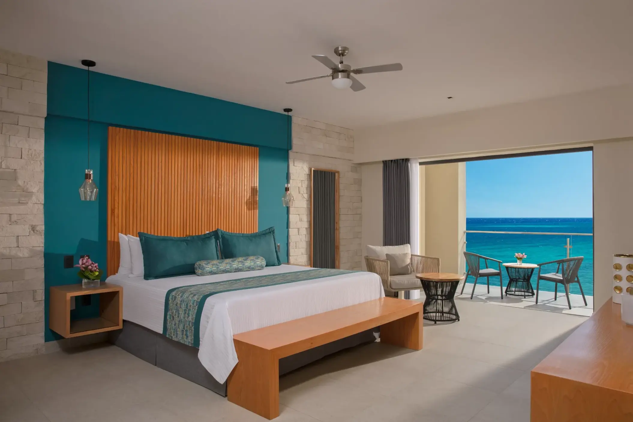 Master suite ocean view bedroom with a private balcony at Dreams Cozumel, Cozumel