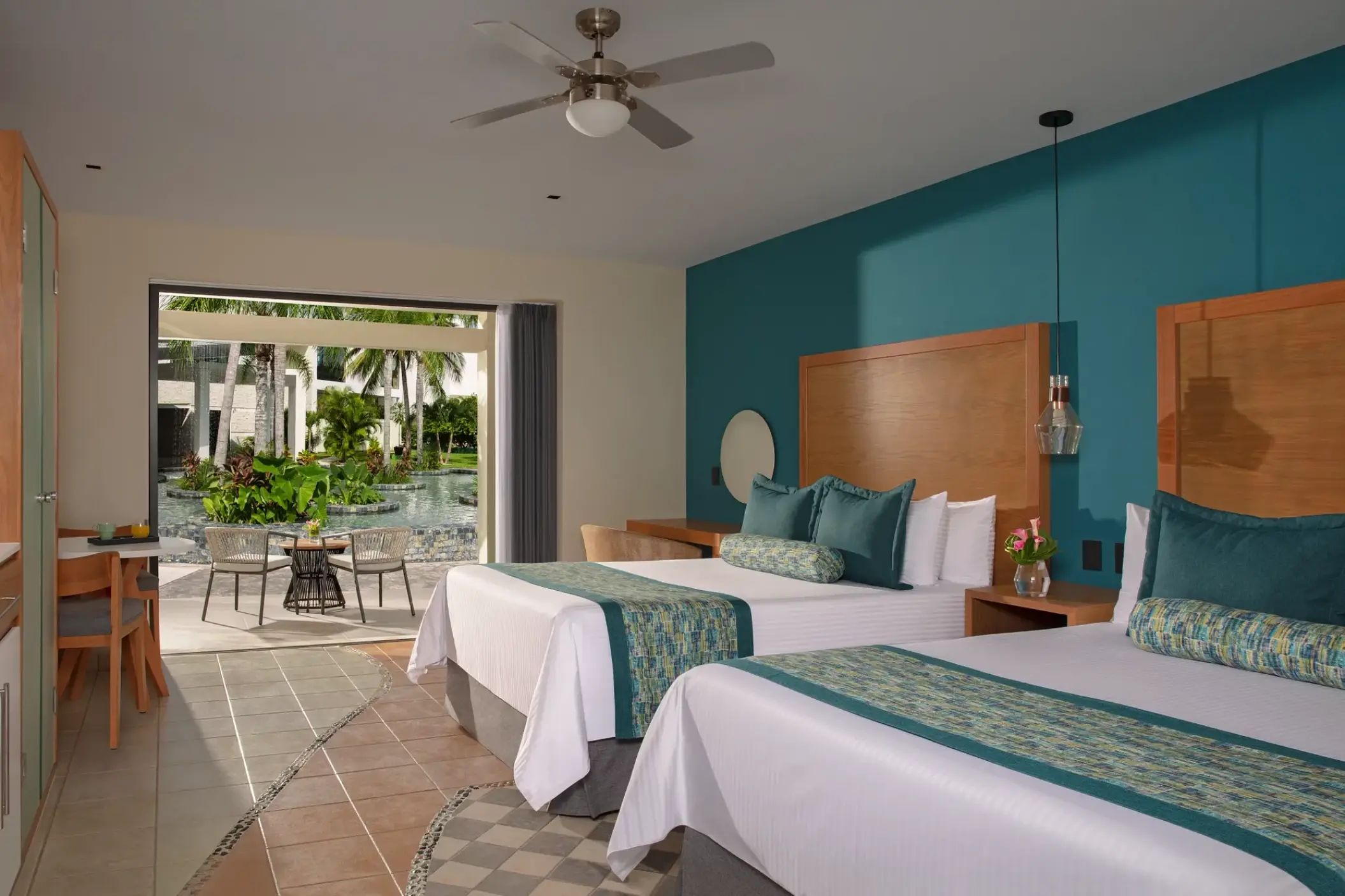 Junior Suite with two beds and tropical view patio at Dreams Cozumel, Cozumel