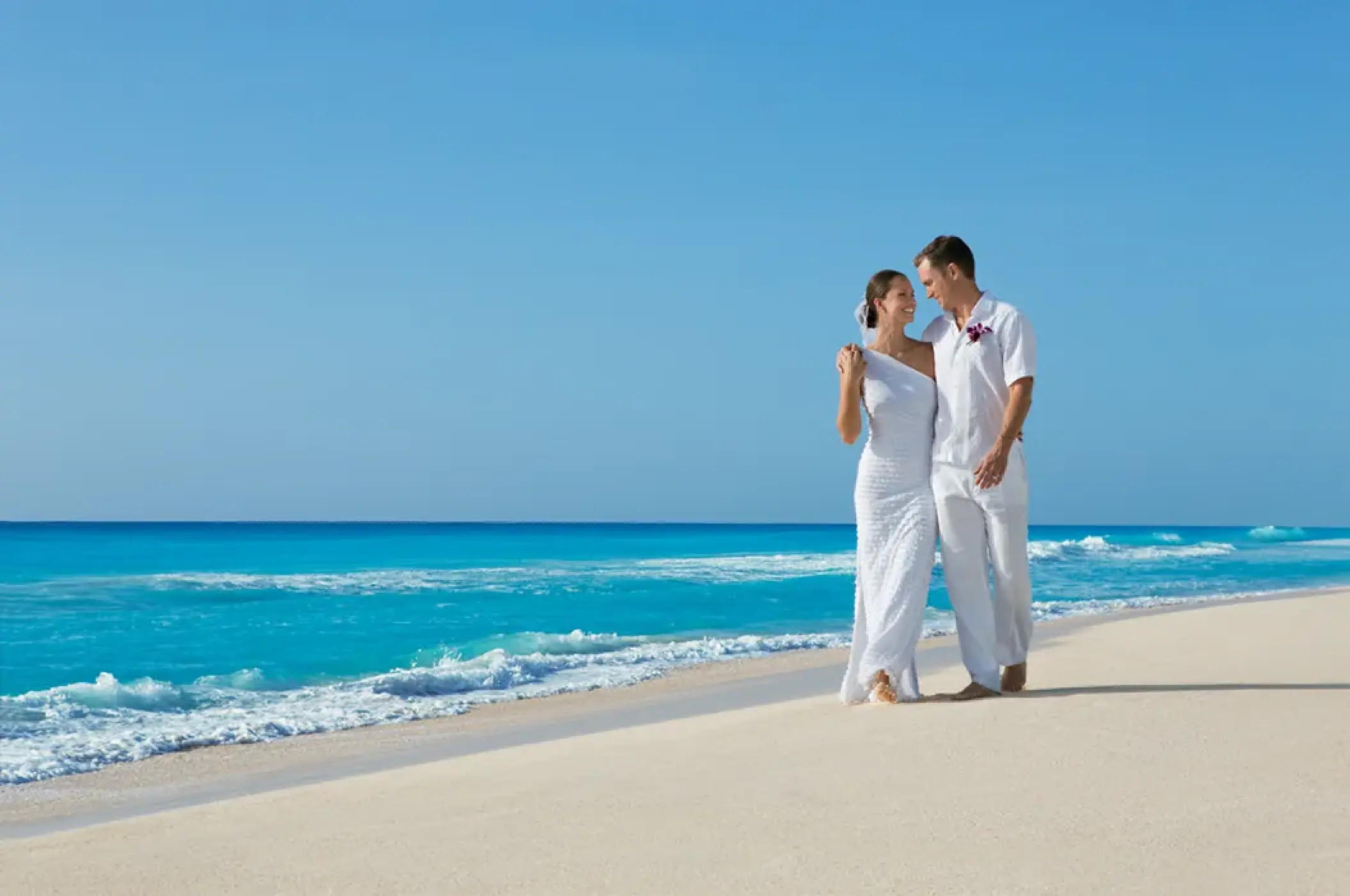 The couple walking along the beach at Dreams Cozumel Cape, Cozumel