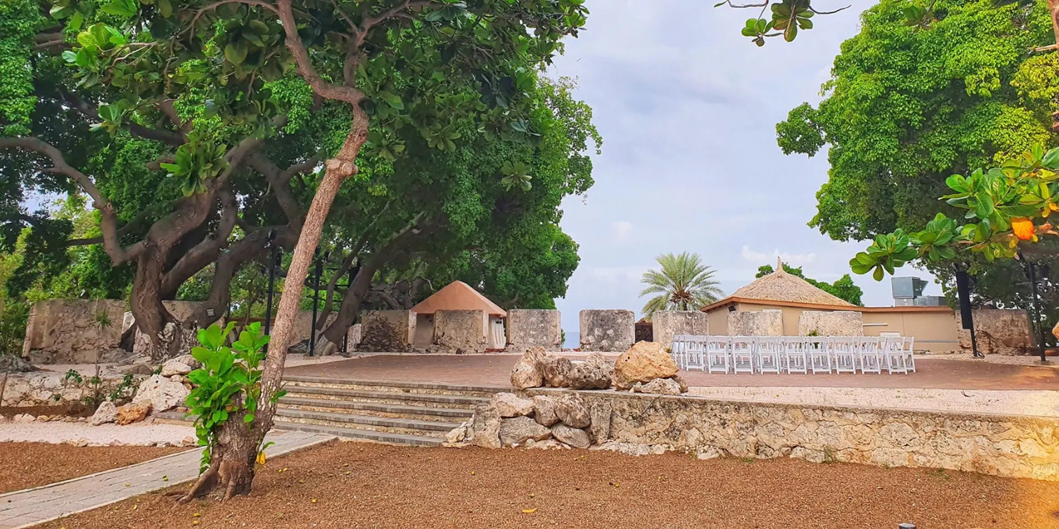 Historic fort wedding ceremony venue with white chairs at Dreams Curacao, Willemstad
