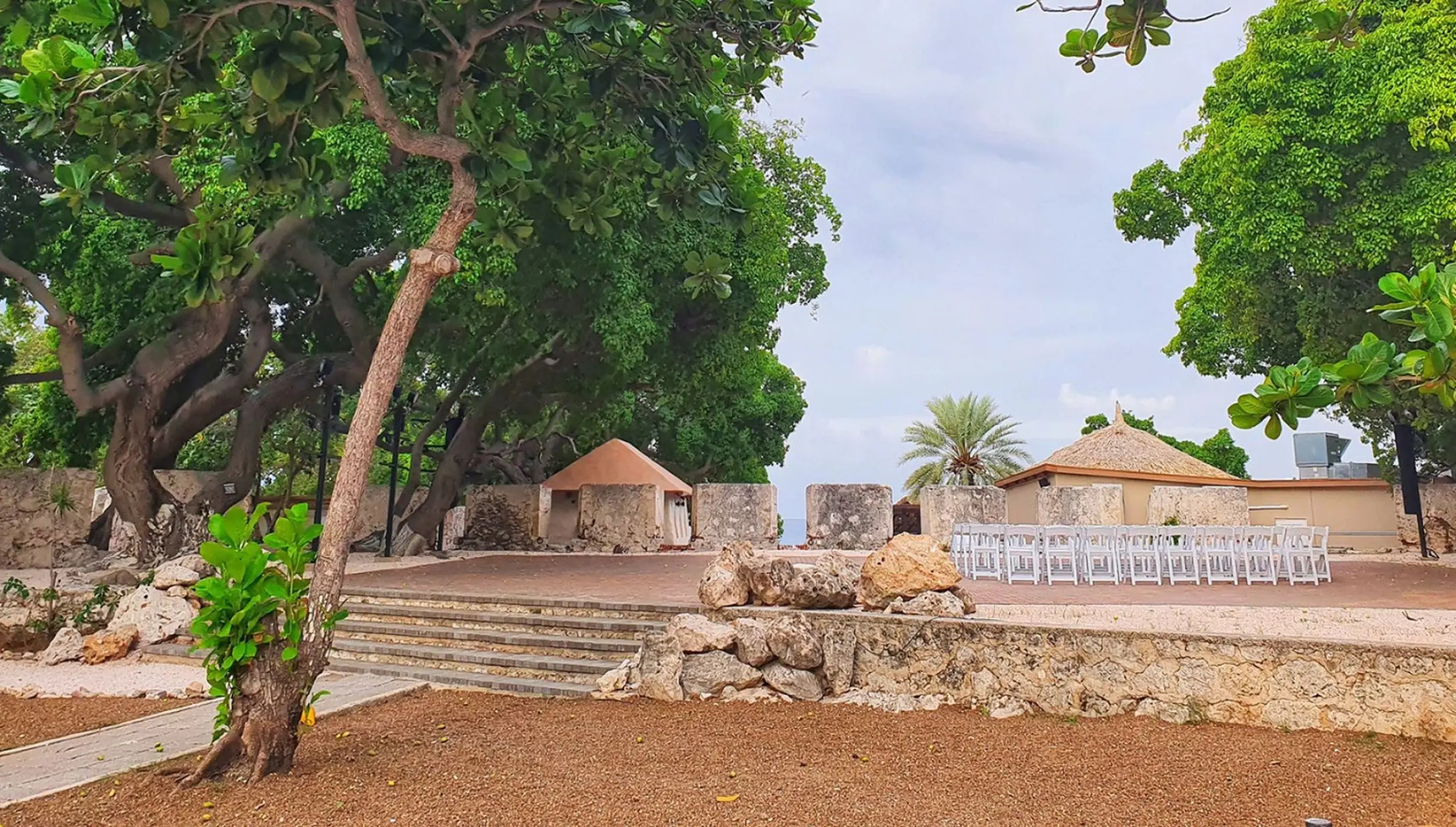 Historic fort wedding ceremony venue with white chairs at Dreams Curacao, Willemstad