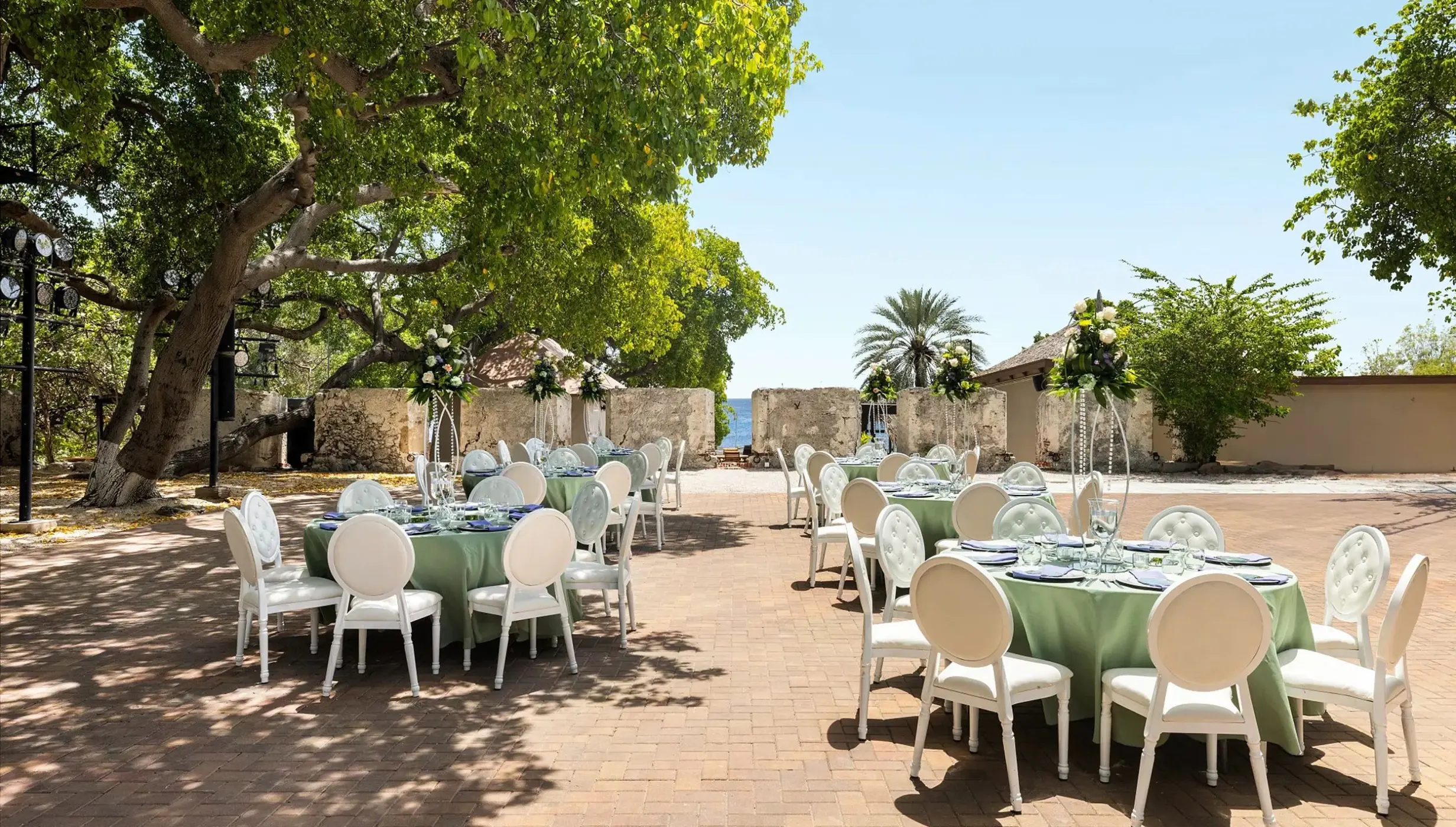 Outdoor wedding reception at the 18th-century fort venue at Dreams Curacao, Willemstad