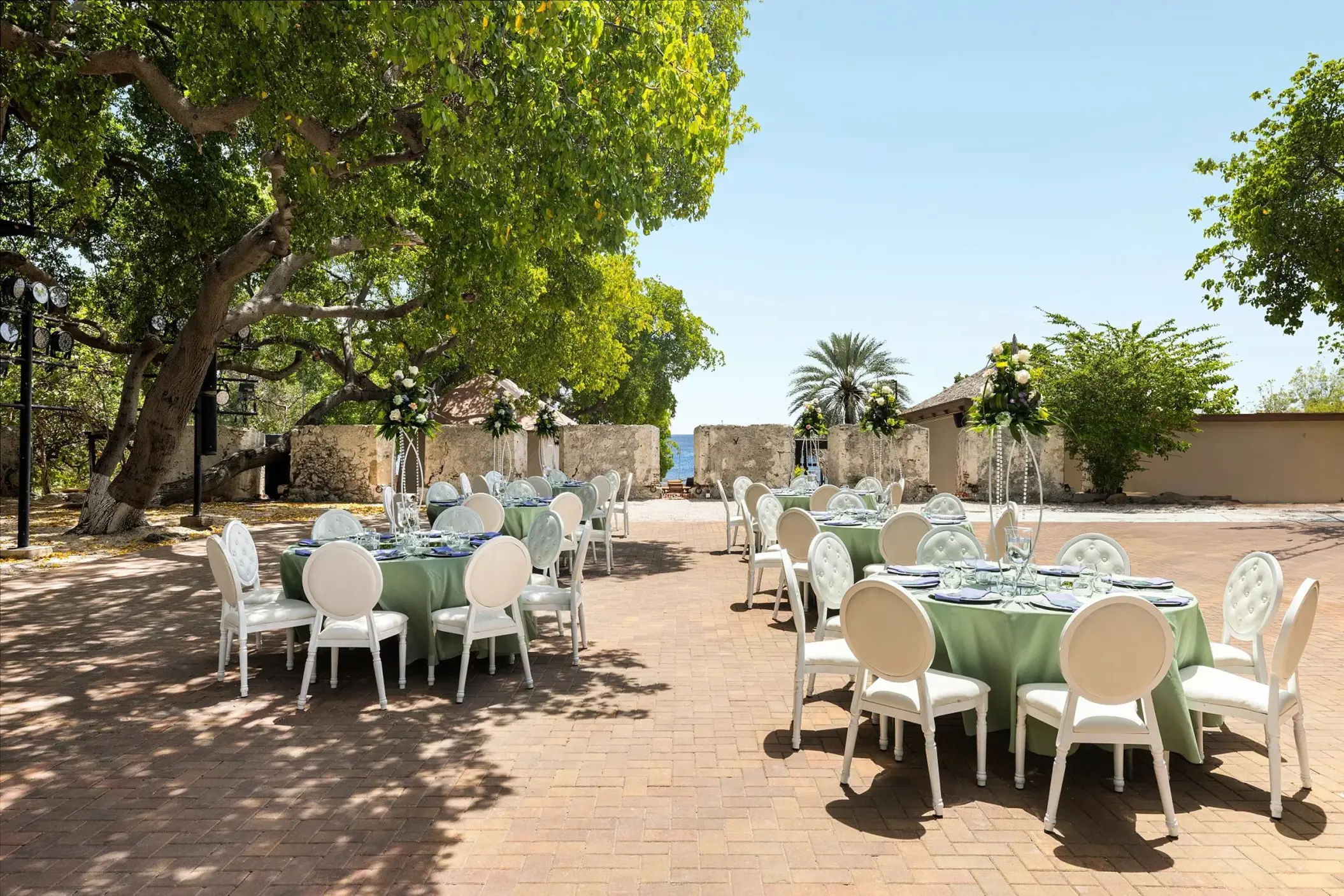 Outdoor wedding reception at the 18th-century fort venue at Dreams Curacao, Willemstad
