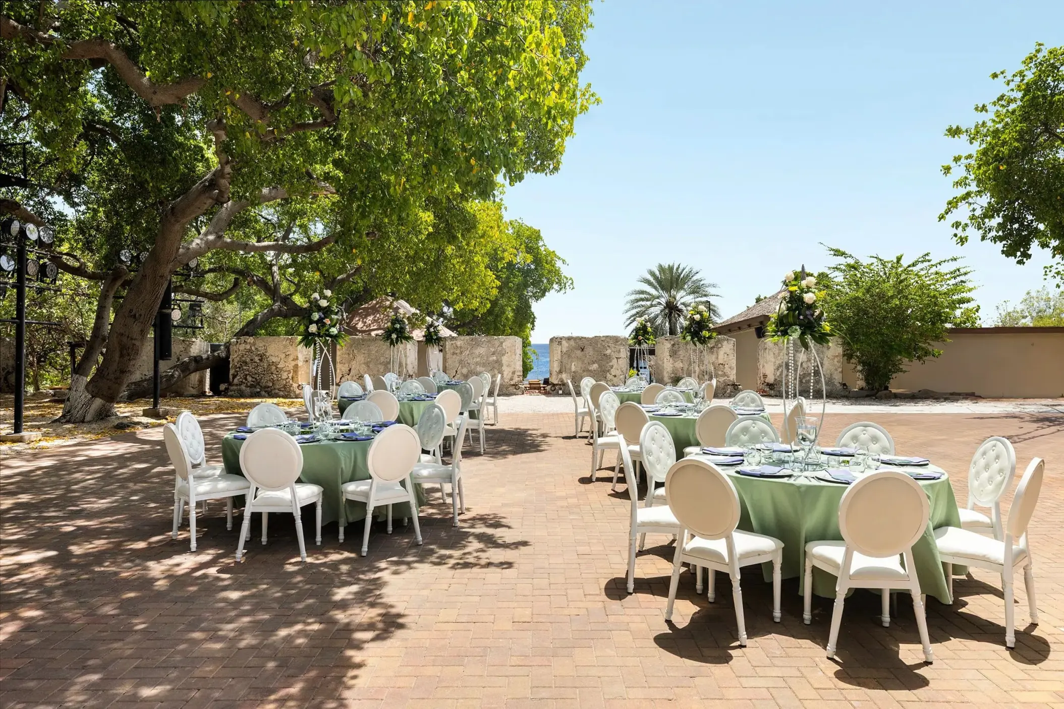 Outdoor wedding reception at the 18th-century fort venue at Dreams Curacao, Willemstad
