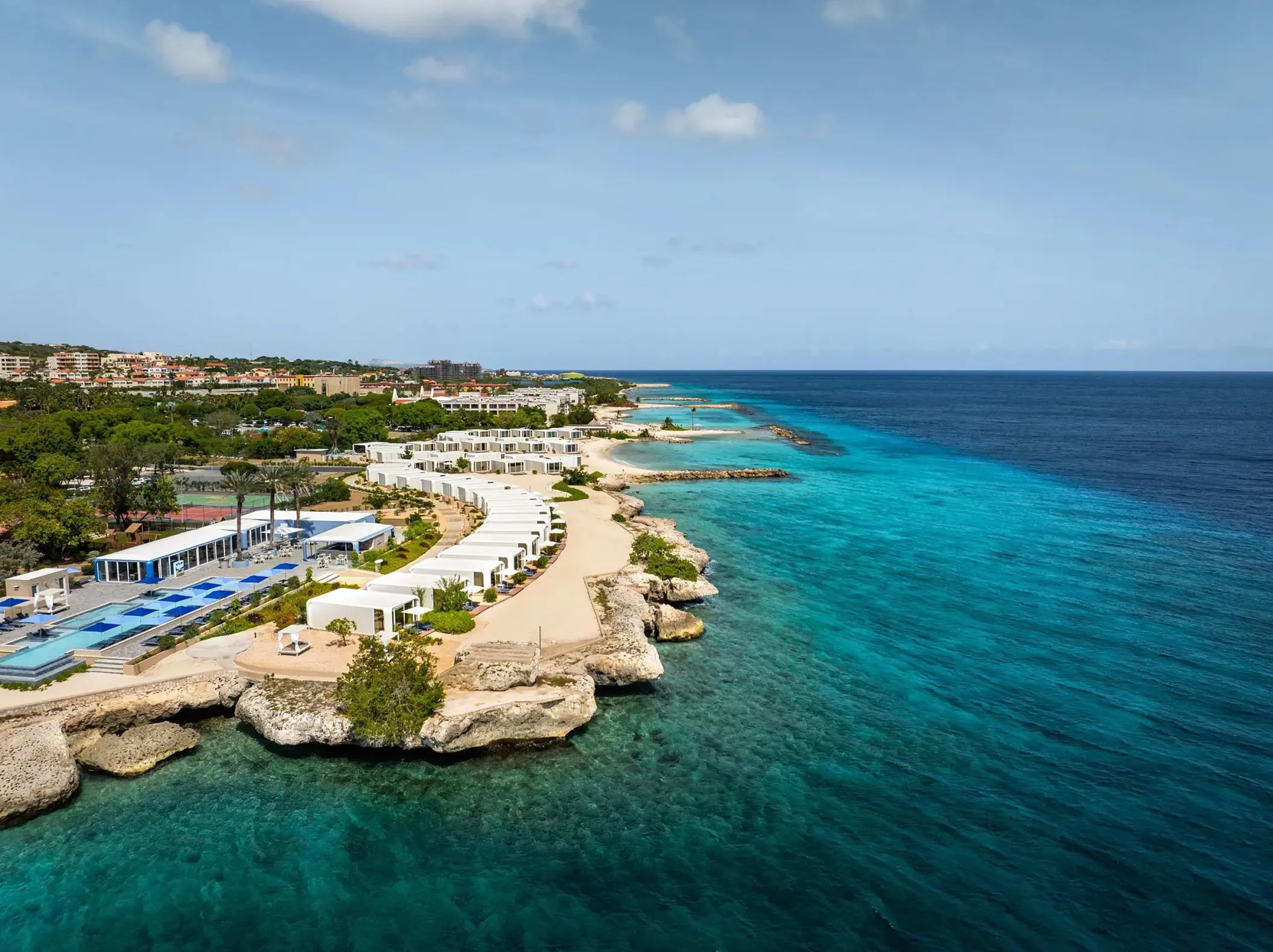 Aerial view of Dreams Curacao beachfront buildings and turquoise water, Willemstad
