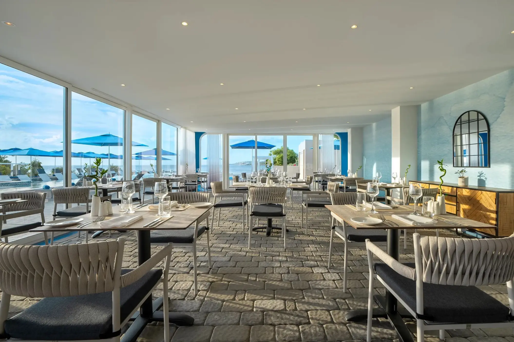 Barettalino restaurant dining area with floor-to-ceiling windows at Dreams Curacao, Willemstad