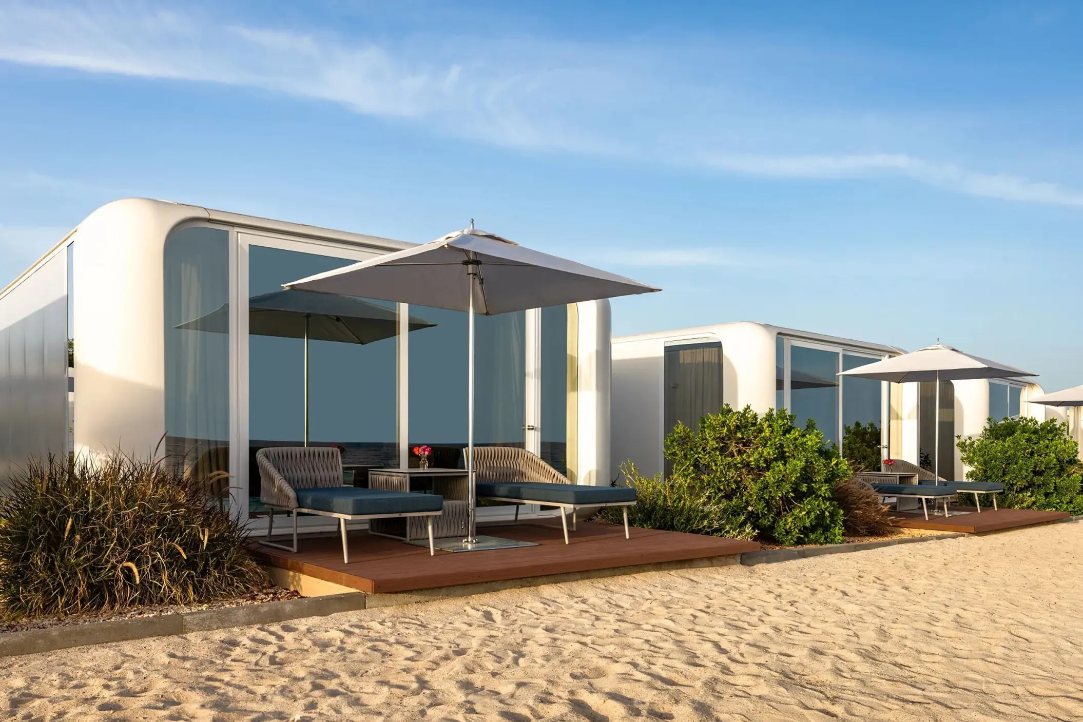 Modern beach bungalows with sun loungers at Dreams Curacao, Willemstad