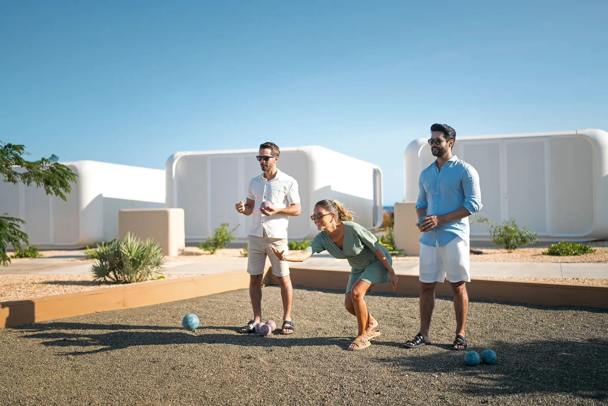 Guests playing bocce ball on a gravel court at Dreams Curacao, Willemstad