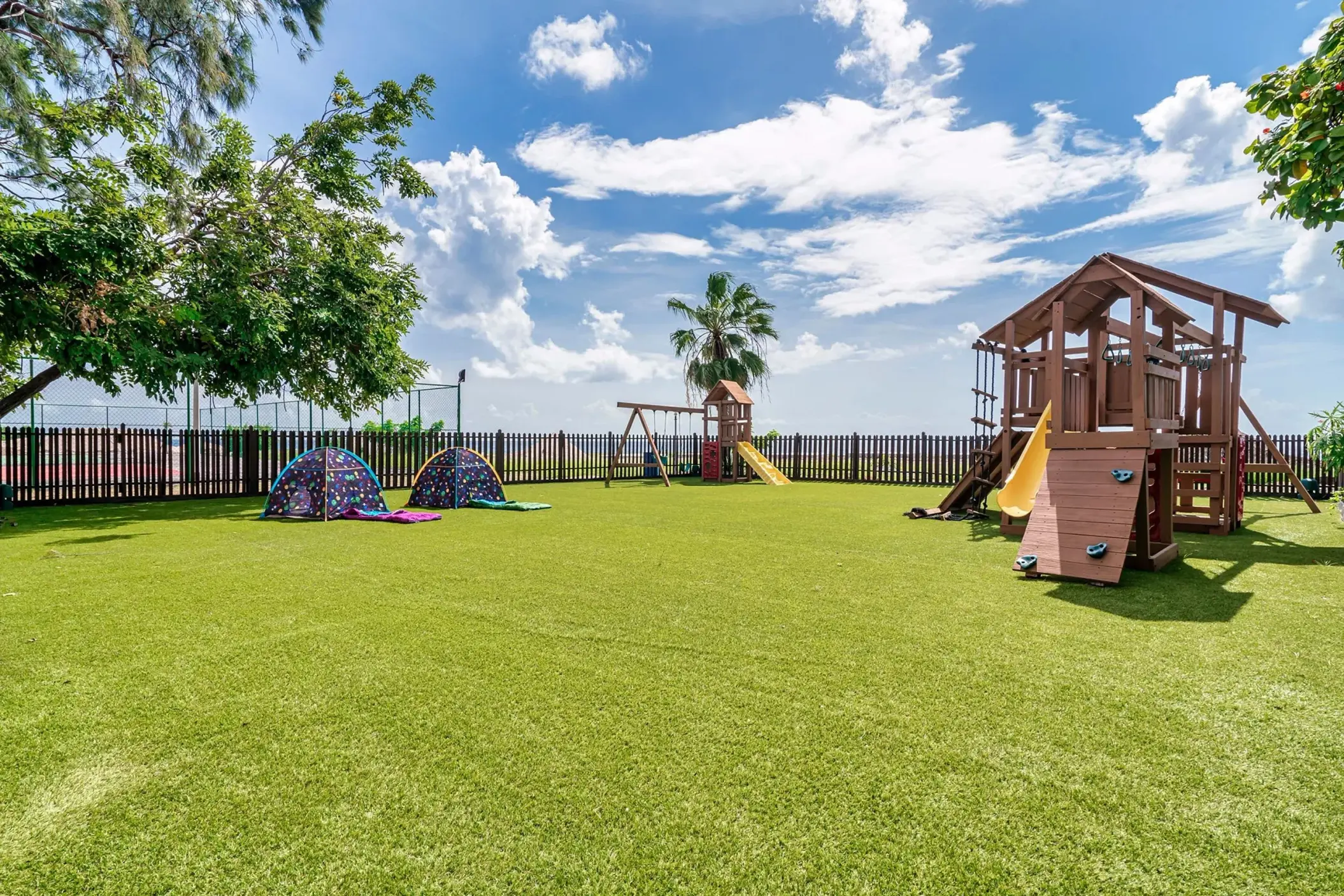 Explorer's Club playground with wooden structures and tents at Dreams Curacao, Willemstad