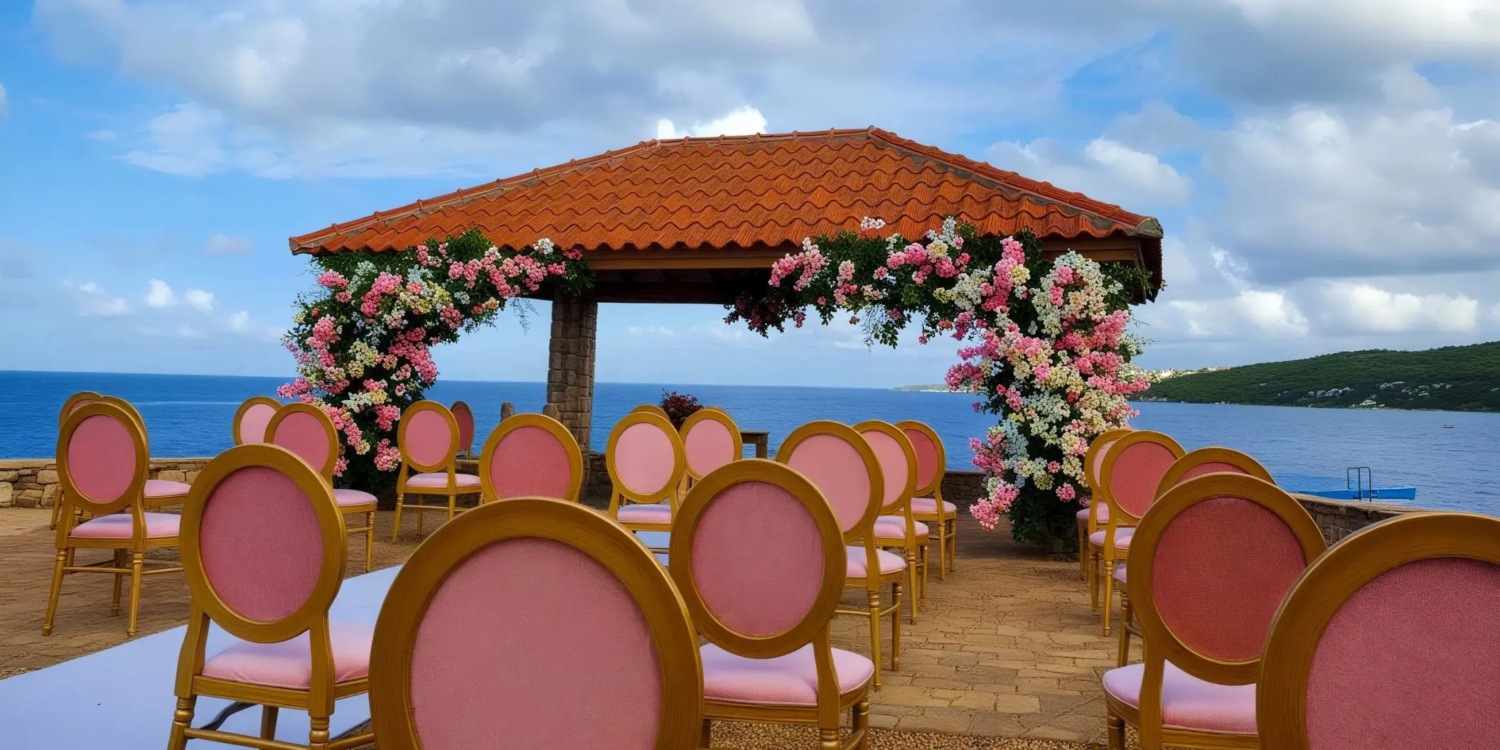 Oceanfront wedding ceremony gazebo with pink floral arrangements and chairs at Dreams Curacao, Willemstad