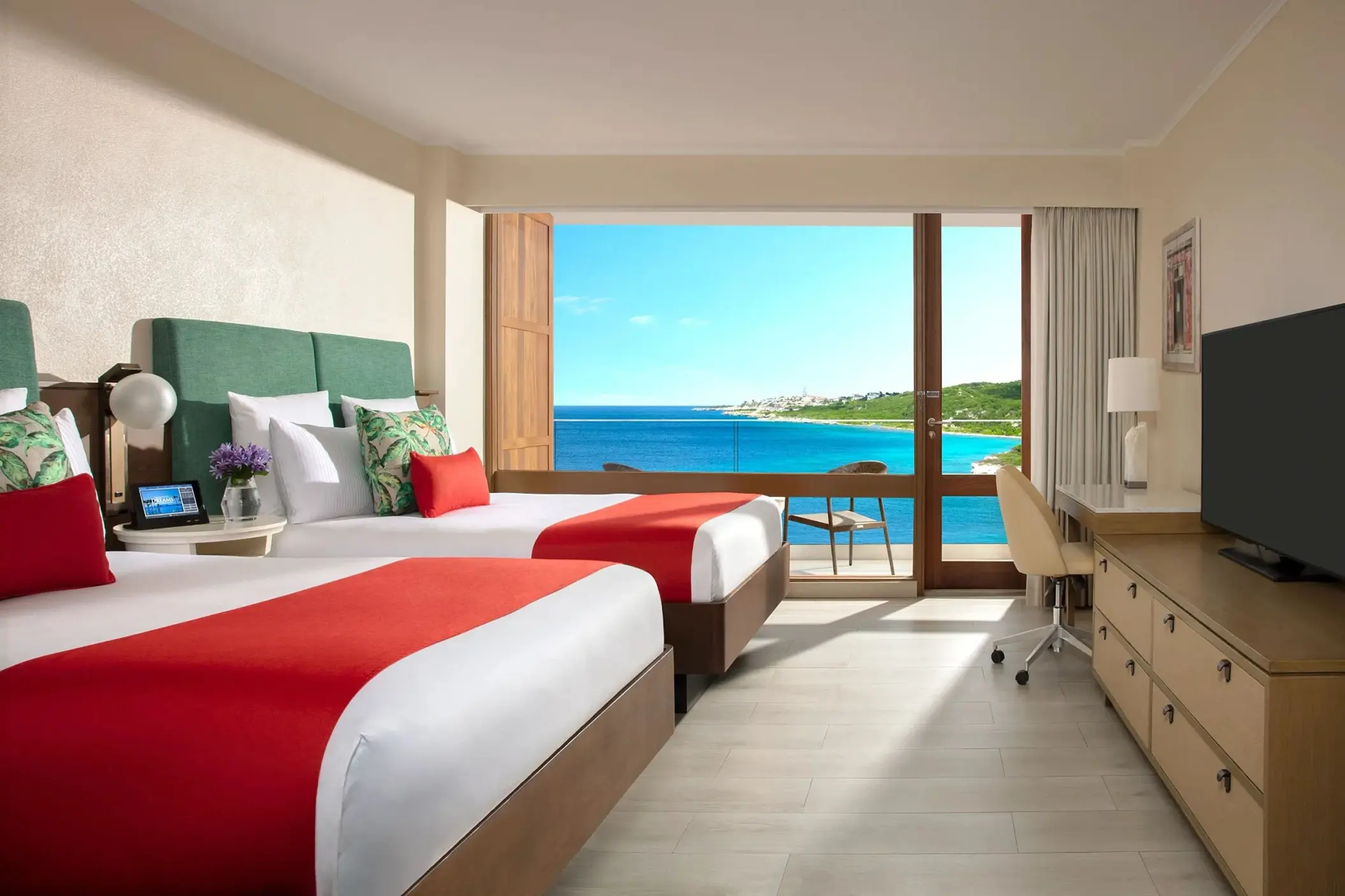Ocean view suite with double beds and a private balcony at Dreams Curacao, Willemstad