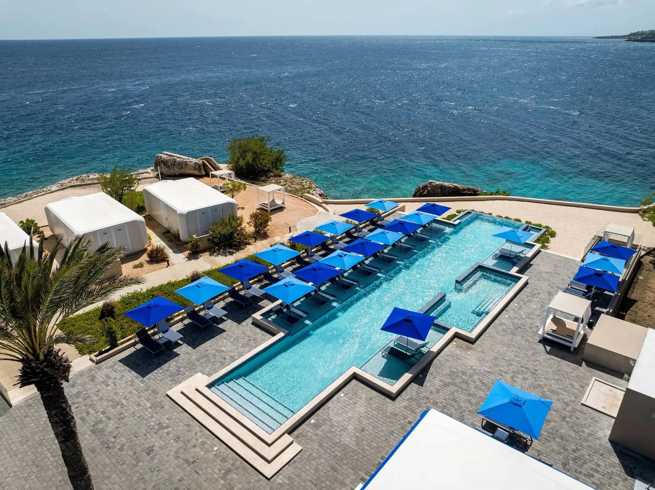 Pool and bungalows overlooking the Caribbean Sea at Dreams Curacao, Willemstad
