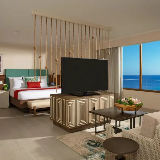 Modern suite with a separate sitting area and ocean view at Dreams Curacao, Willemstad