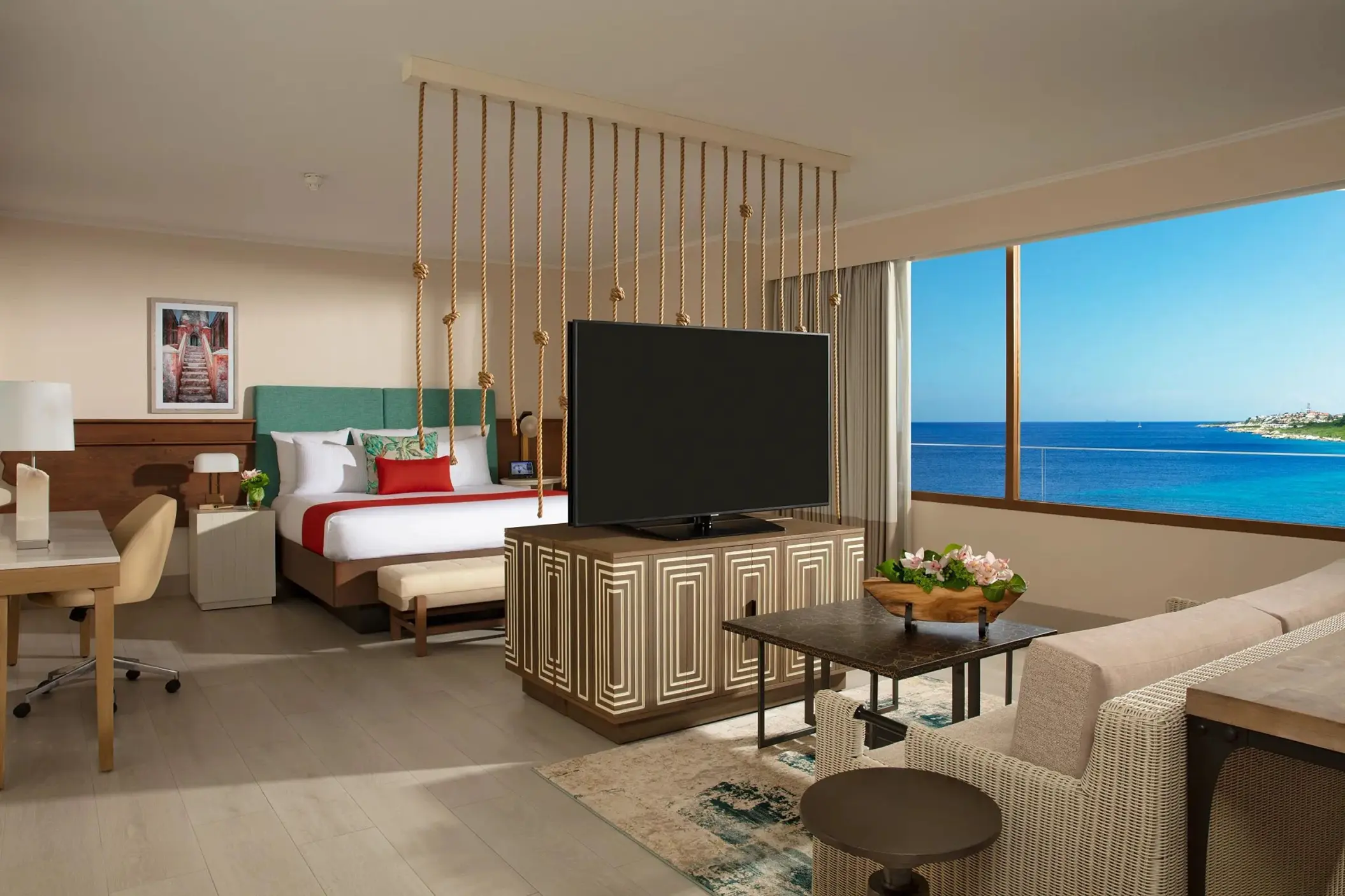 Modern suite with a separate sitting area and ocean view at Dreams Curacao, Willemstad