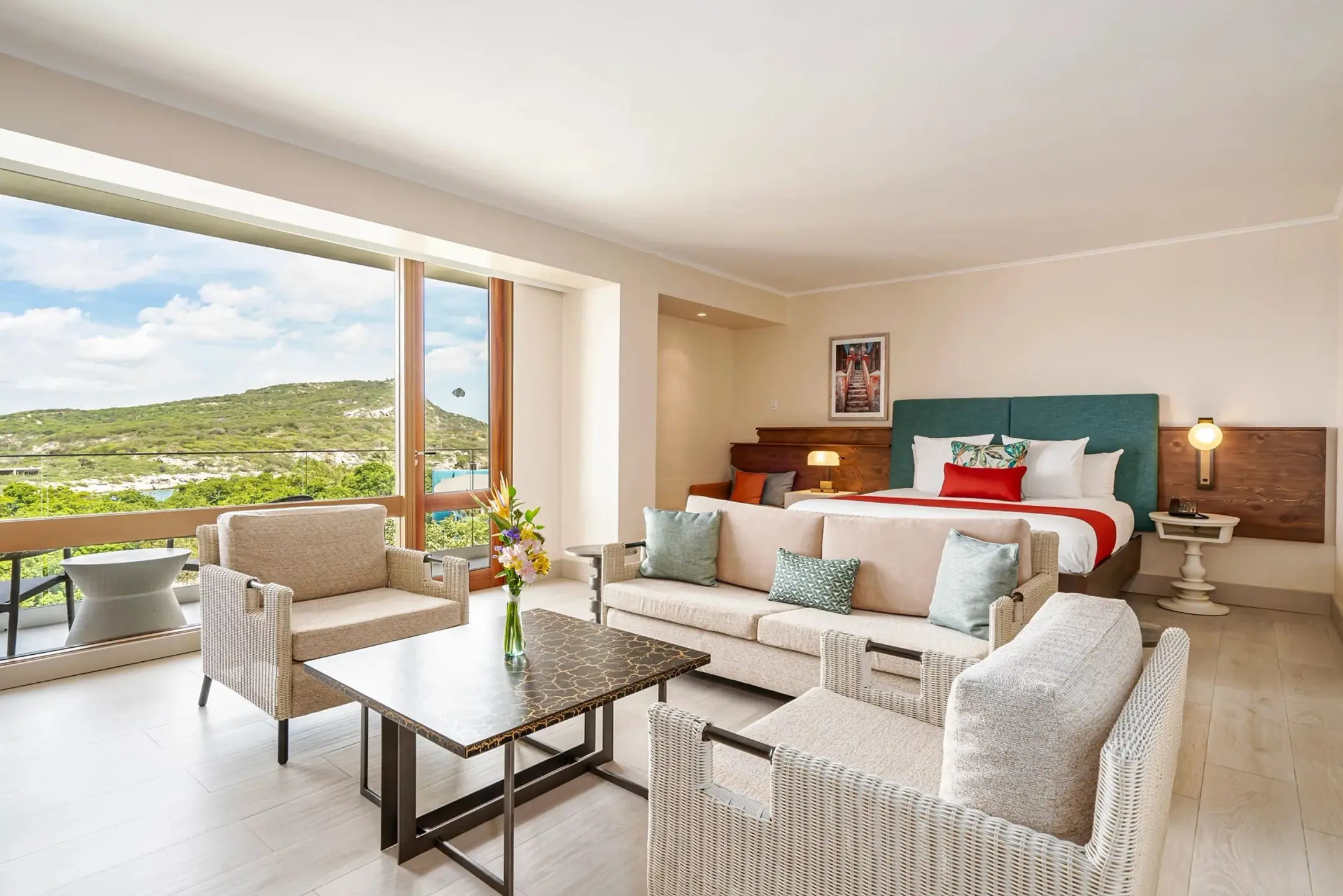 Guest suite with seating area and hill views at Dreams Curacao, Willemstad