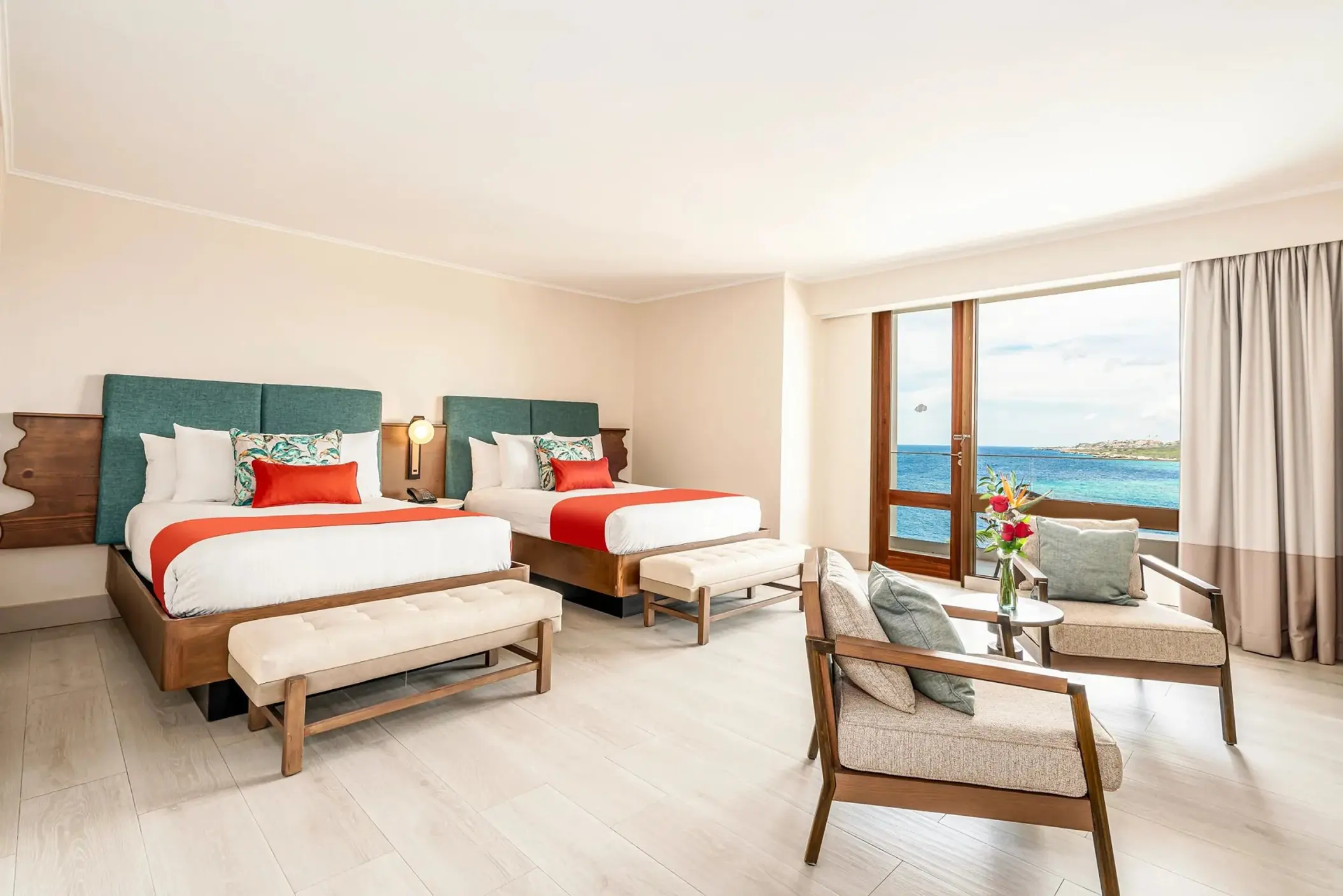 Suite with two double beds and an ocean view at Dreams Curacao, Willemstad