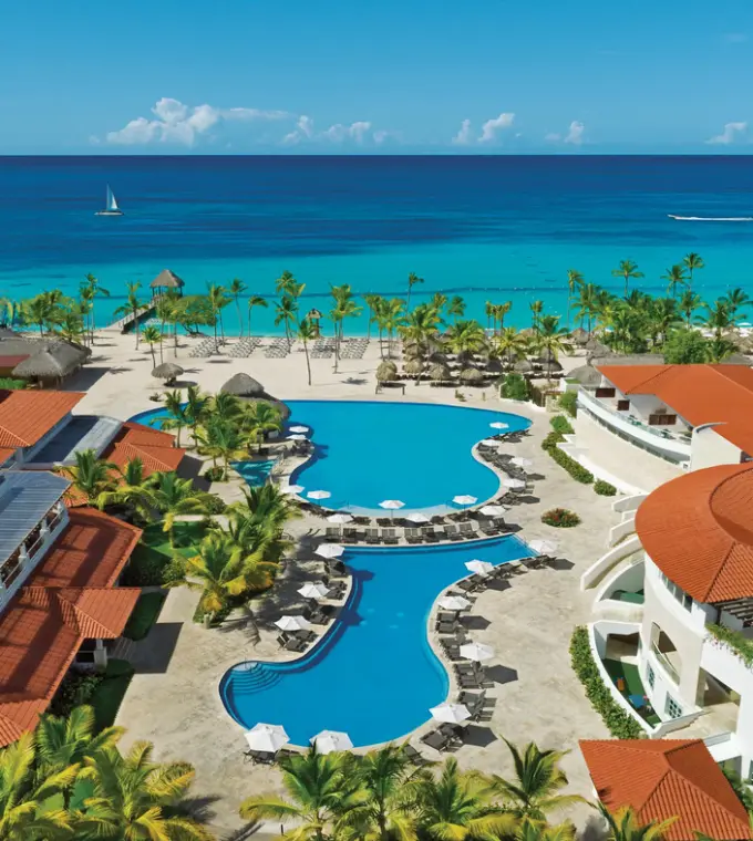 Aerial view of swimming pools and beachfront at Dreams Dominicus, La Romana