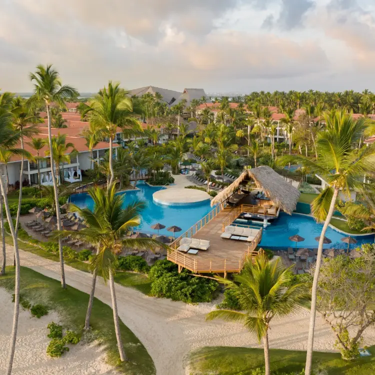Aerial view of swimming pools and palm-lined grounds at Dreams Flora, Punta Cana