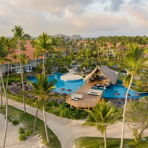 Aerial view of swimming pools and palm-lined grounds at Dreams Flora, Punta Cana